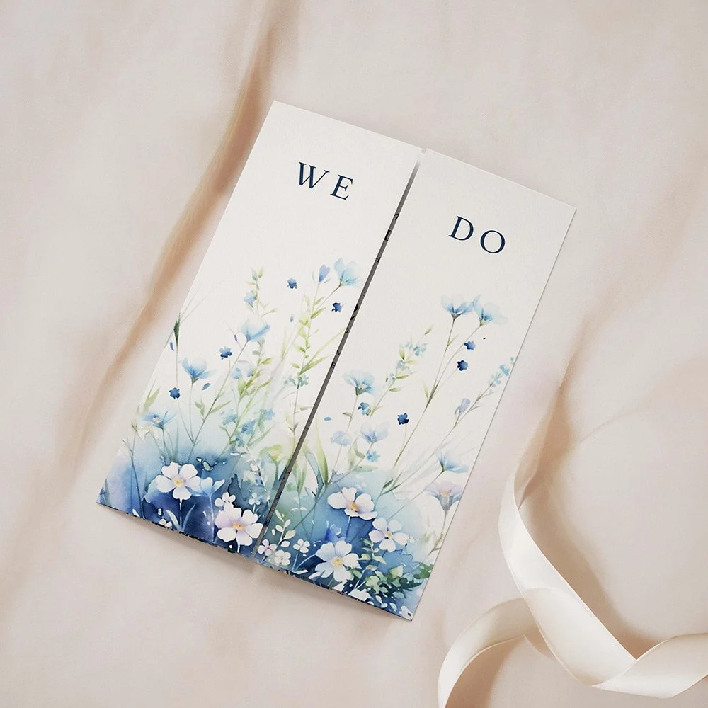 Dusty blue gatefold wedding invitation with trailing wildflower design