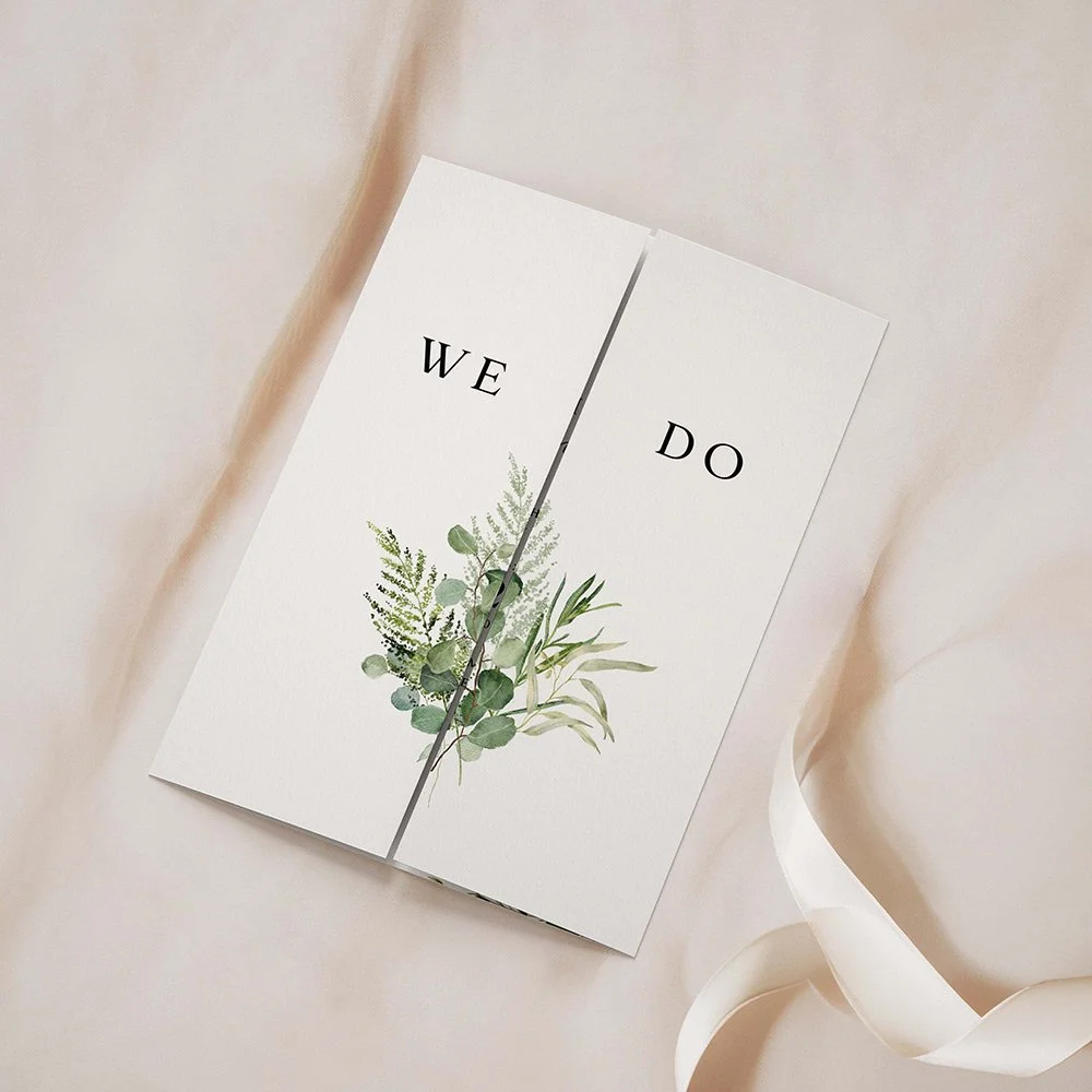 Greenery Collection gatefold wedding invitation closed, featuring watercolour sage and forest green foliage with elegant black typography.