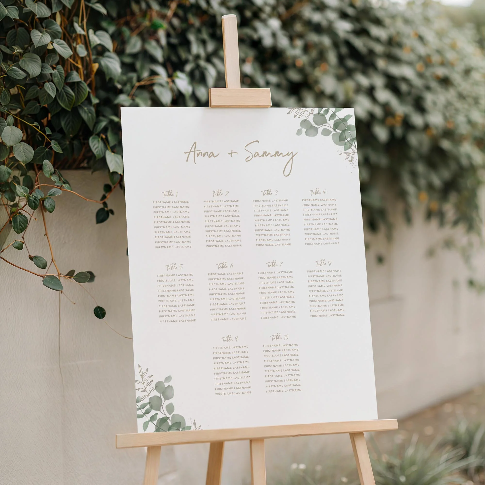 Close-up of the Modern Eucalyptus wedding seating plan board displayed outdoors
