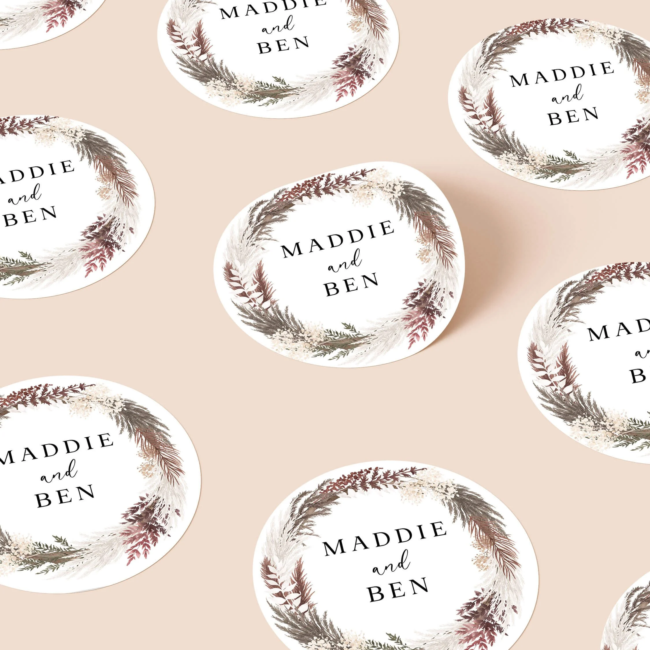 Blush boho wedding stickers with dried grass wreath and initials repeated on personalised round seals