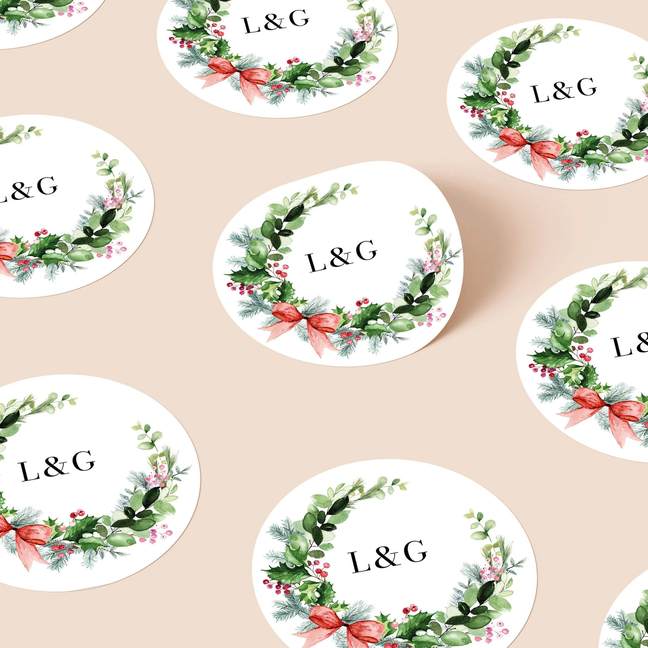 Festive wedding stickers with Christmas greenery wreath and initials repeated on personalised round seals