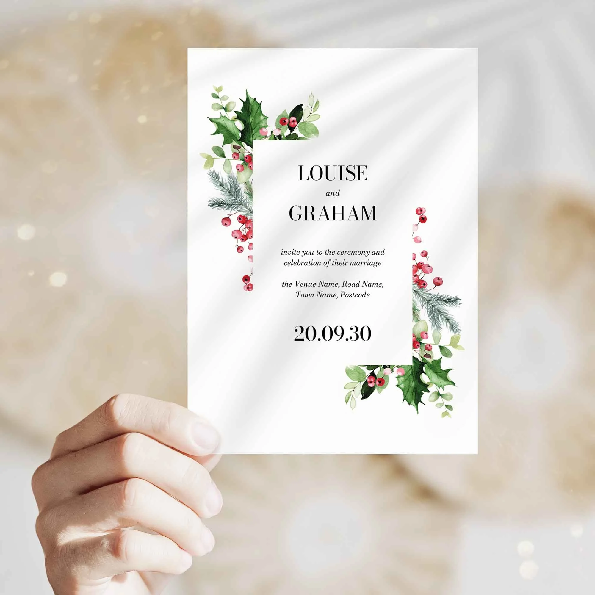 Hand holding Holly and Berry wedding invitation showing size and printed design details