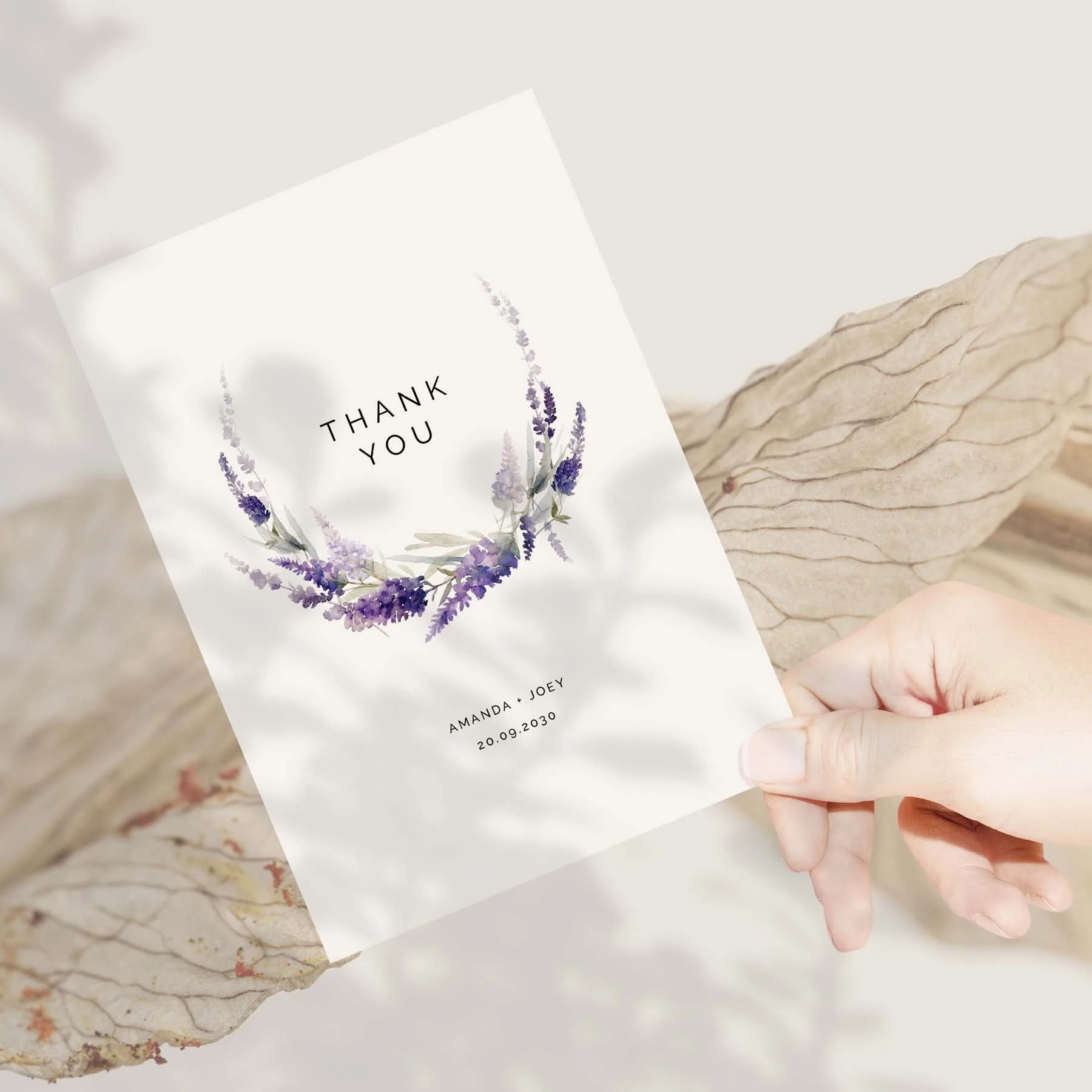 Hand holding a Lavender wedding thank you card