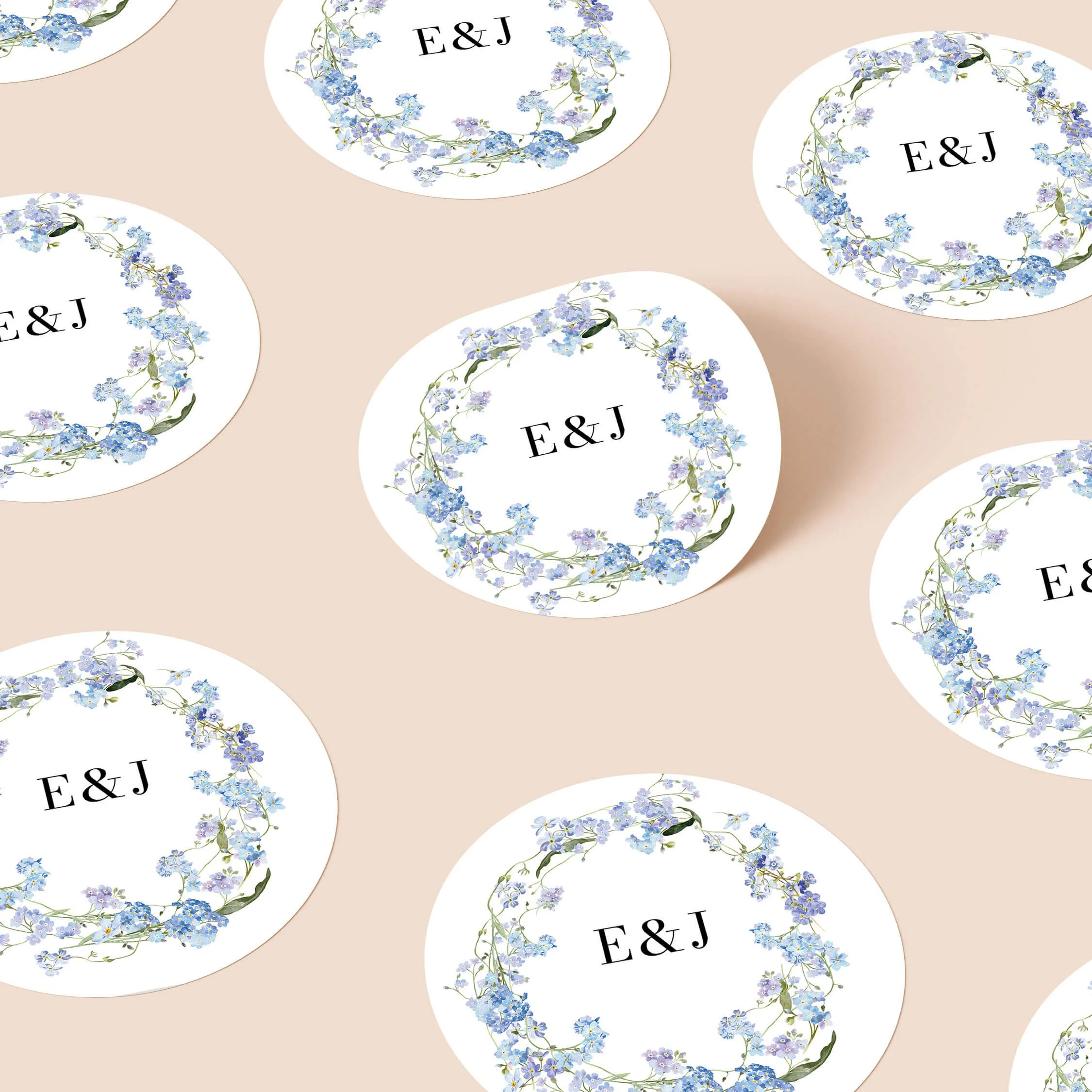 Forget Me Not personalised wedding sticker with blue floral wreath design and elegant initials on round sticker