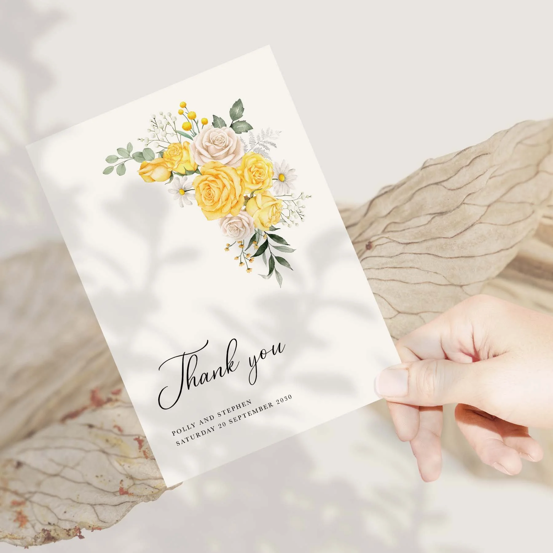 Hand holding a Yellow Rose wedding thank you card