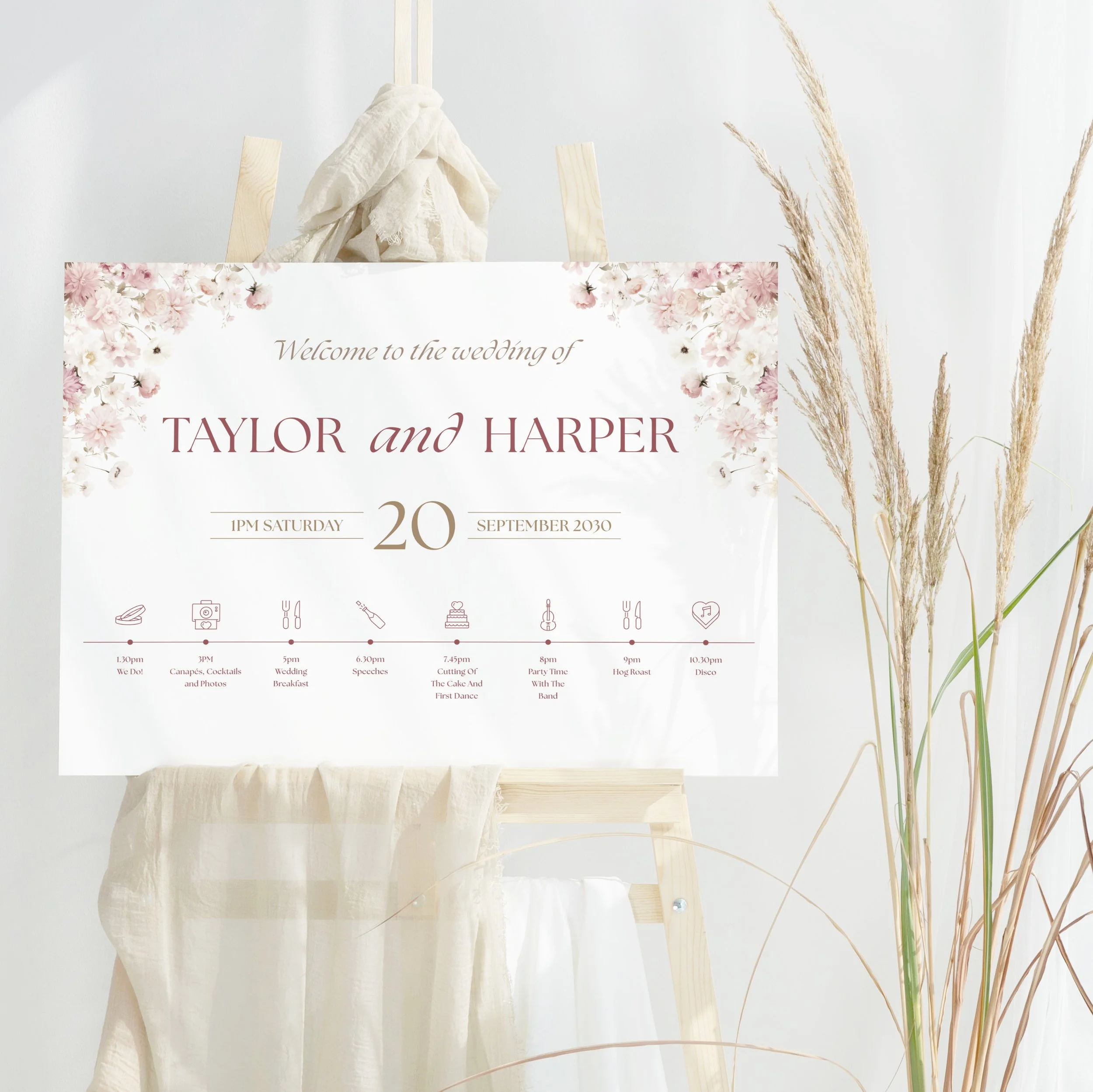 Petal Wedding Welcome Sign with blush pink floral design and Order of the Day timeline printed on board.