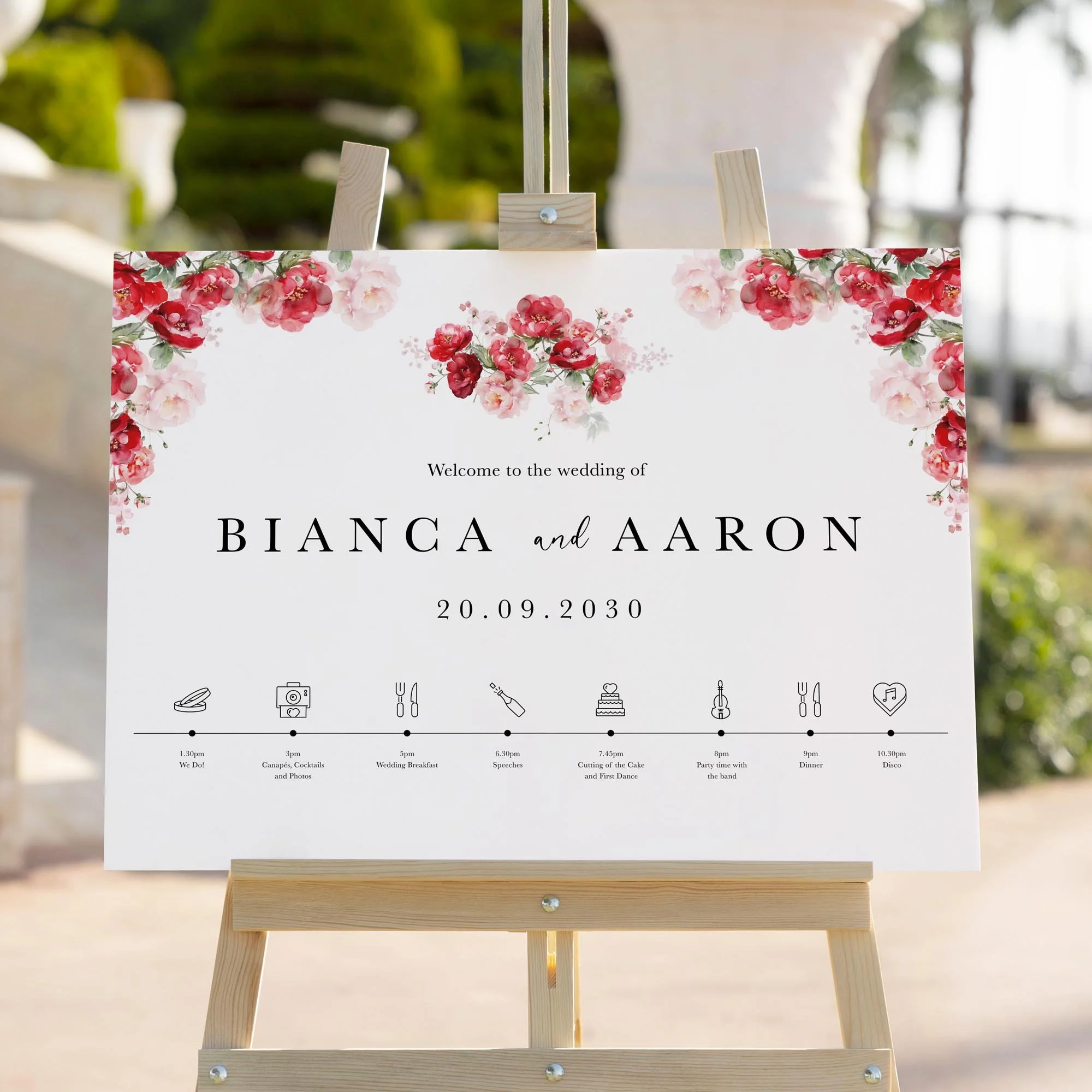 Red Floral wedding welcome sign styled outdoors close-up