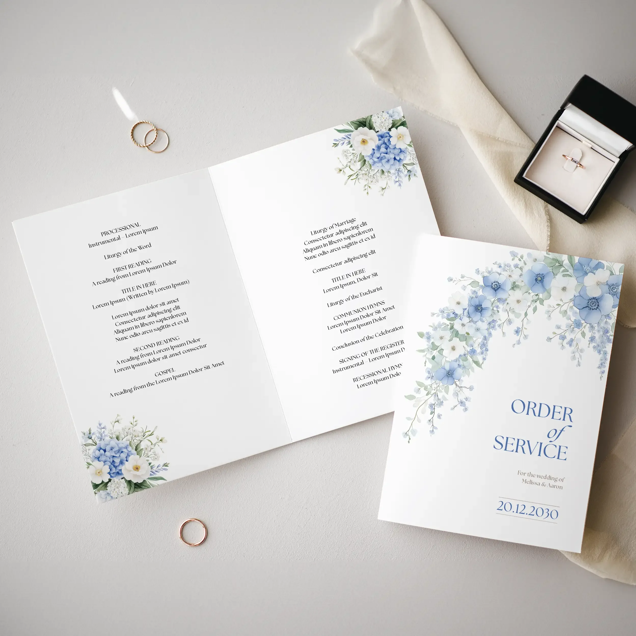 Serenity Order of Service booklet showing cascading blue floral cover and inside ceremony page.