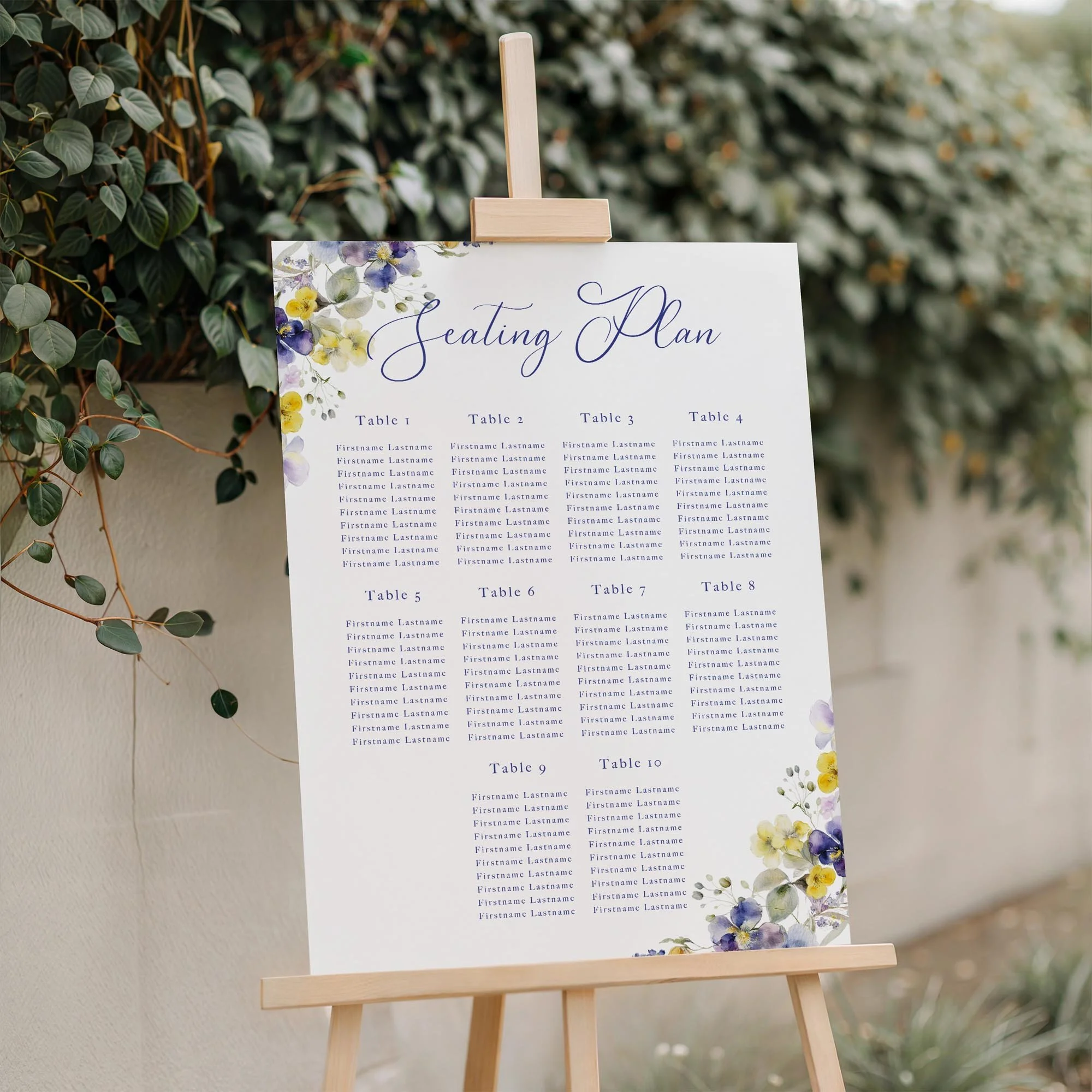 Close-up of the Violet and Yellow Floral wedding seating plan board displayed outdoors