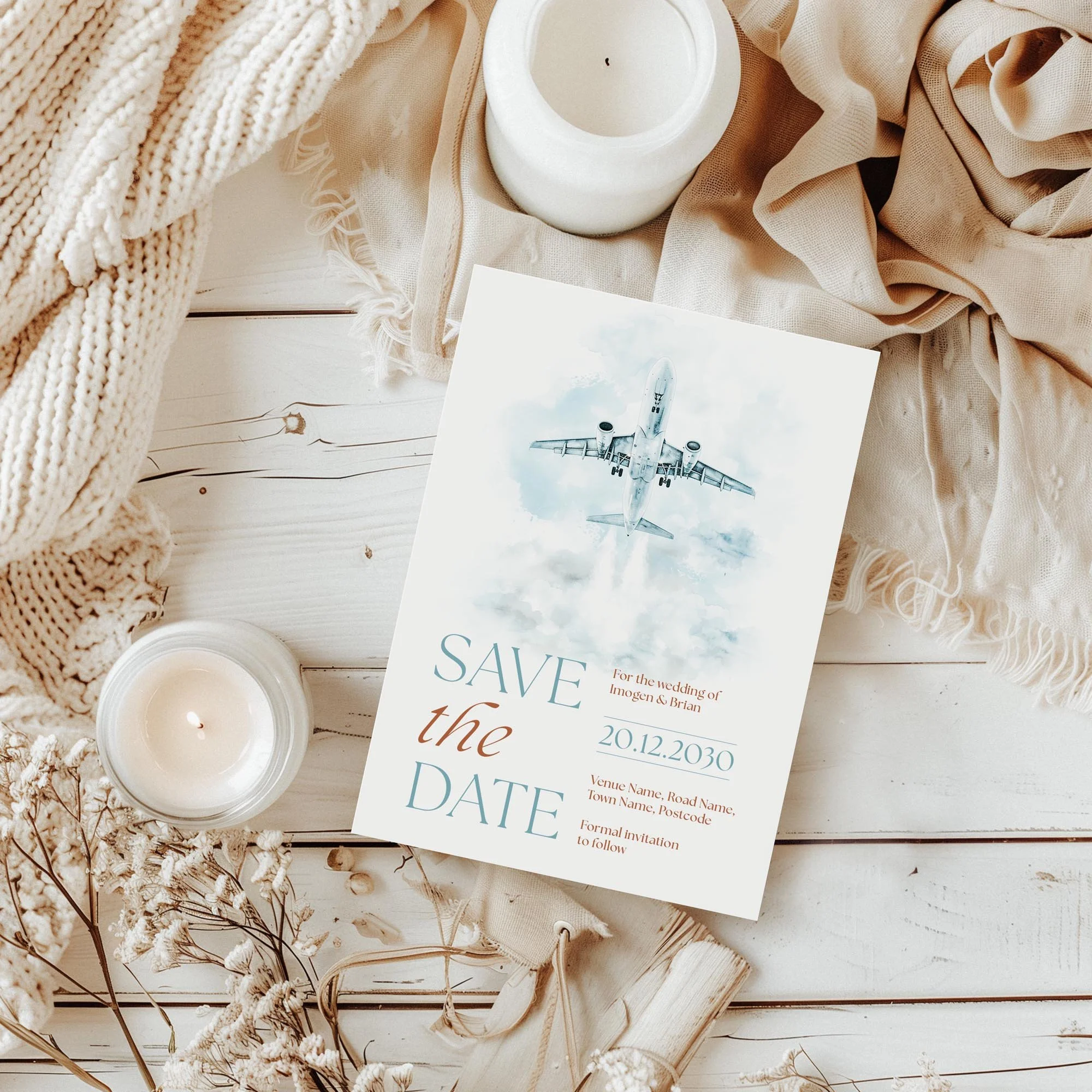 Styled flatlay of the Explorer Save the Date with travel-inspired wedding details.