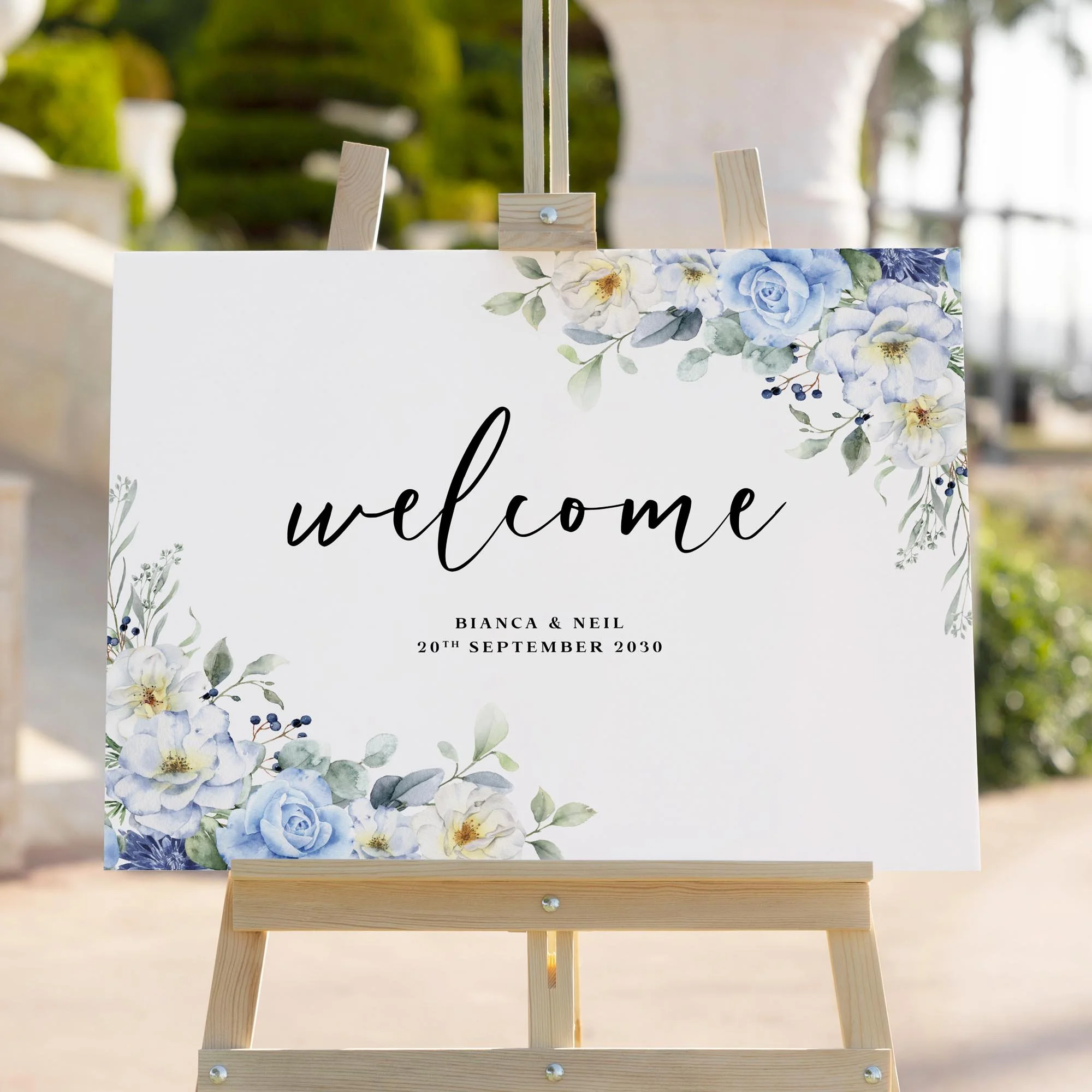 Blue Floral wedding welcome sign styled outdoors close-up