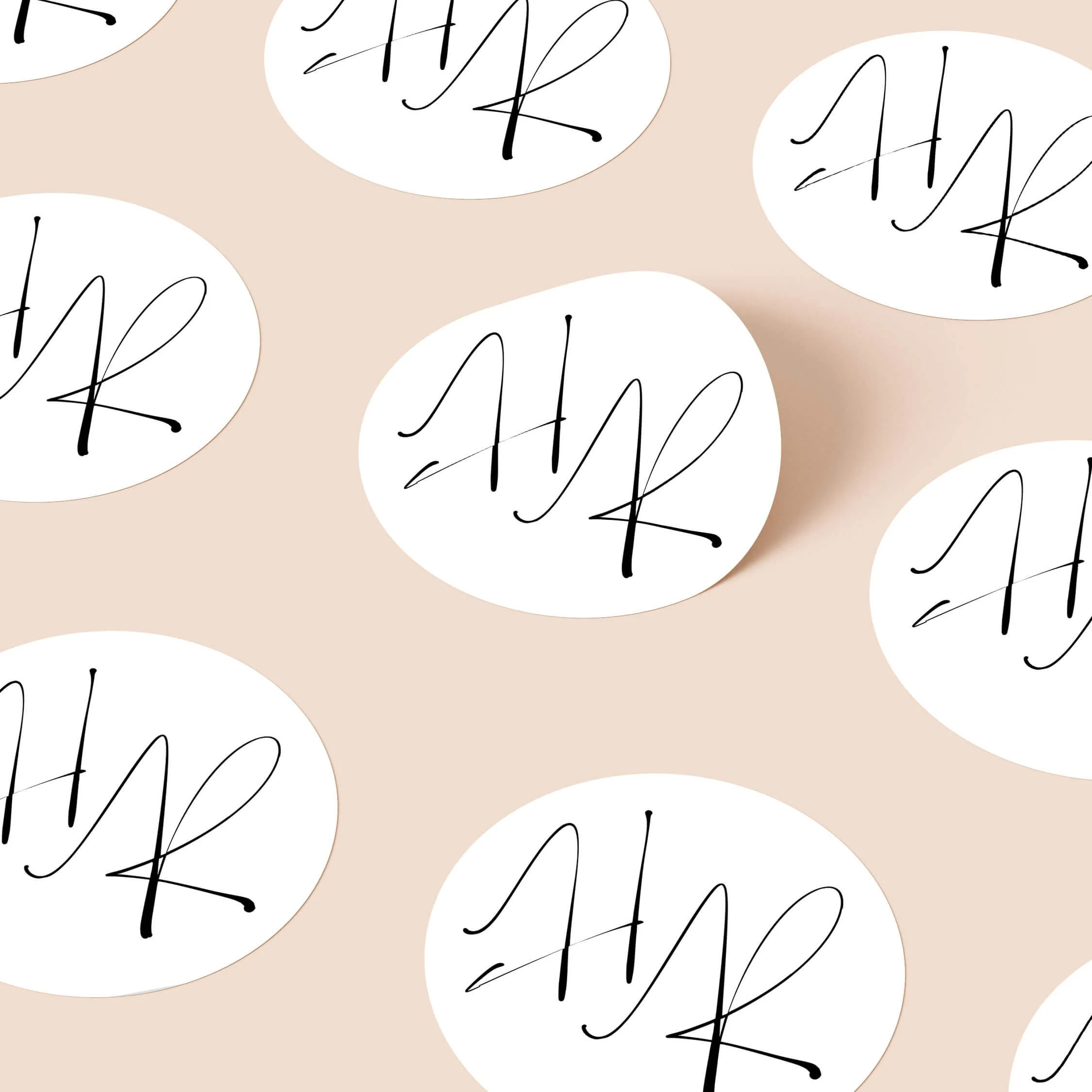 Autograph wedding stickers with bold handwritten initials on round stickers