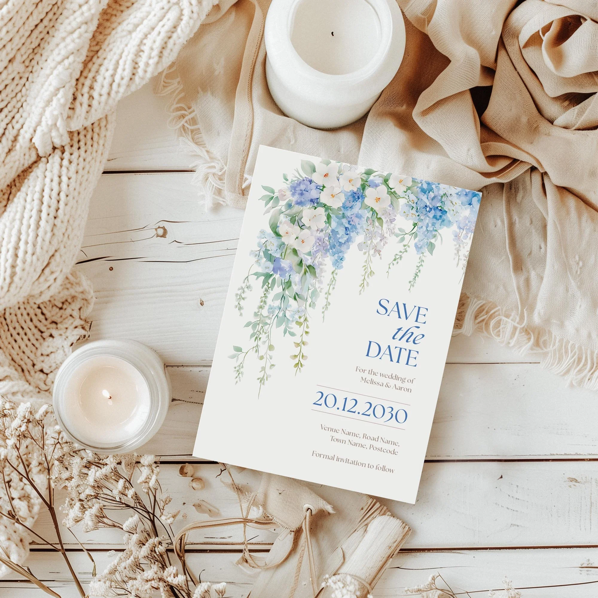Styled flatlay of the Serenity Save the Date in an elegant blue wedding theme.