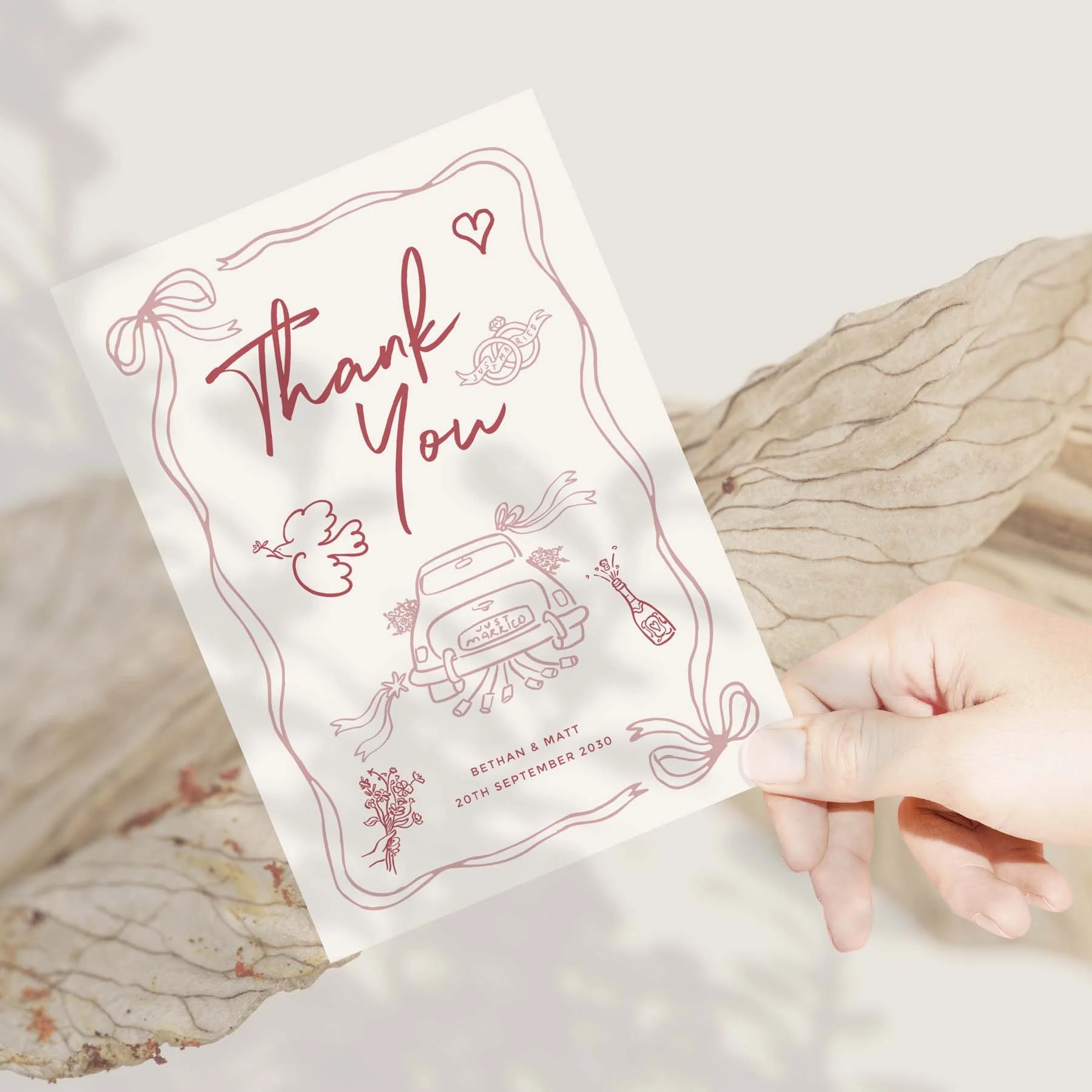 Hand holding a Pink Illustrations wedding thank you card