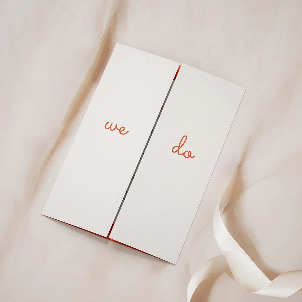 Scallop Collection gatefold wedding invitation closed, featuring a soft pastel orange abstract design with modern typography.