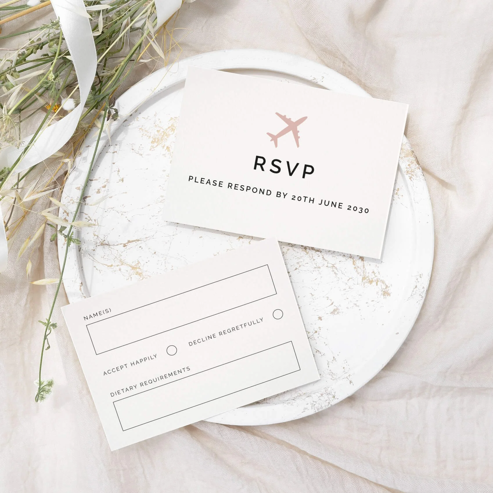 Travel wedding RSVP card with aeroplane icon and clean serif typography on luxury off-white card