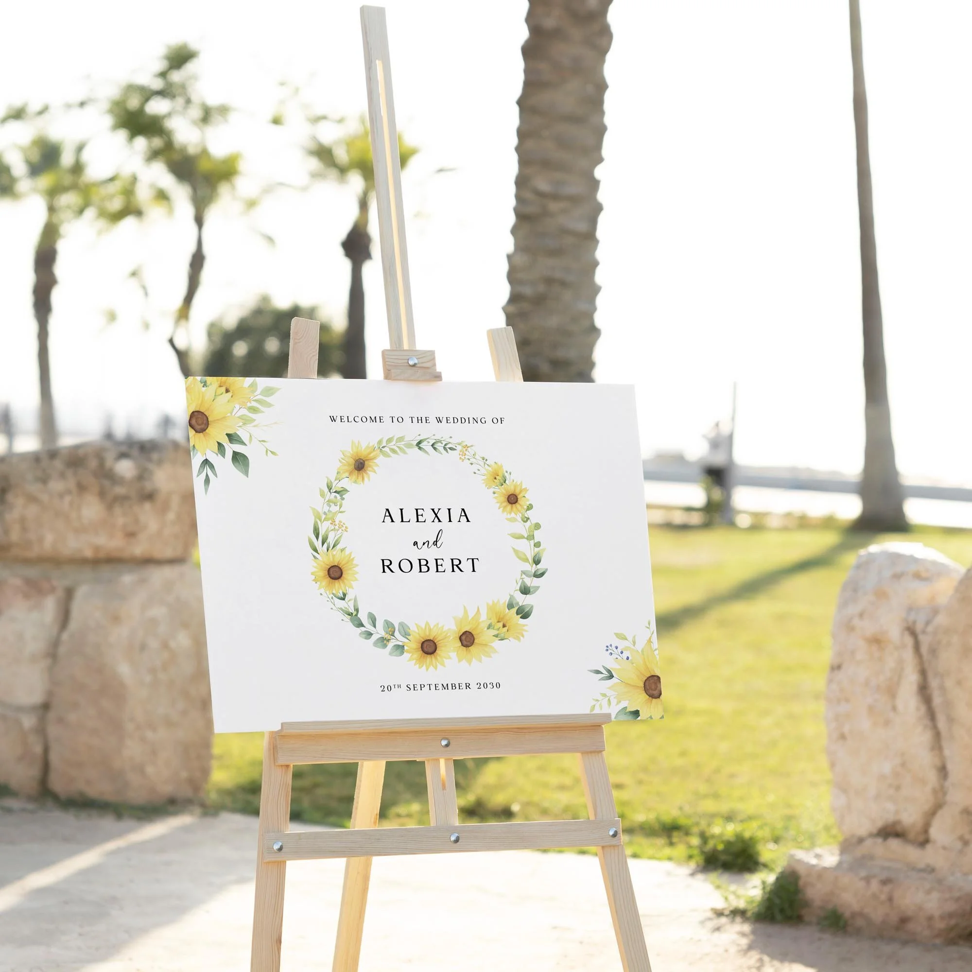 Lemon wedding welcome sign displayed outdoors at a wedding venue on an easel
