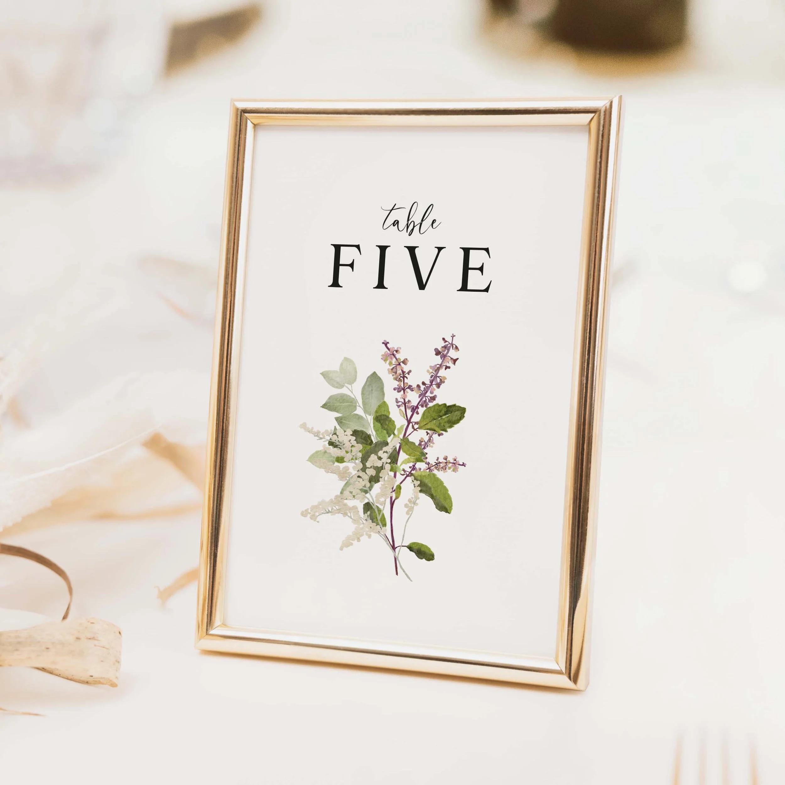 Forest wedding table number with soft purple lavender and woodland botanical spray illustration and clean typography on luxury off-white card