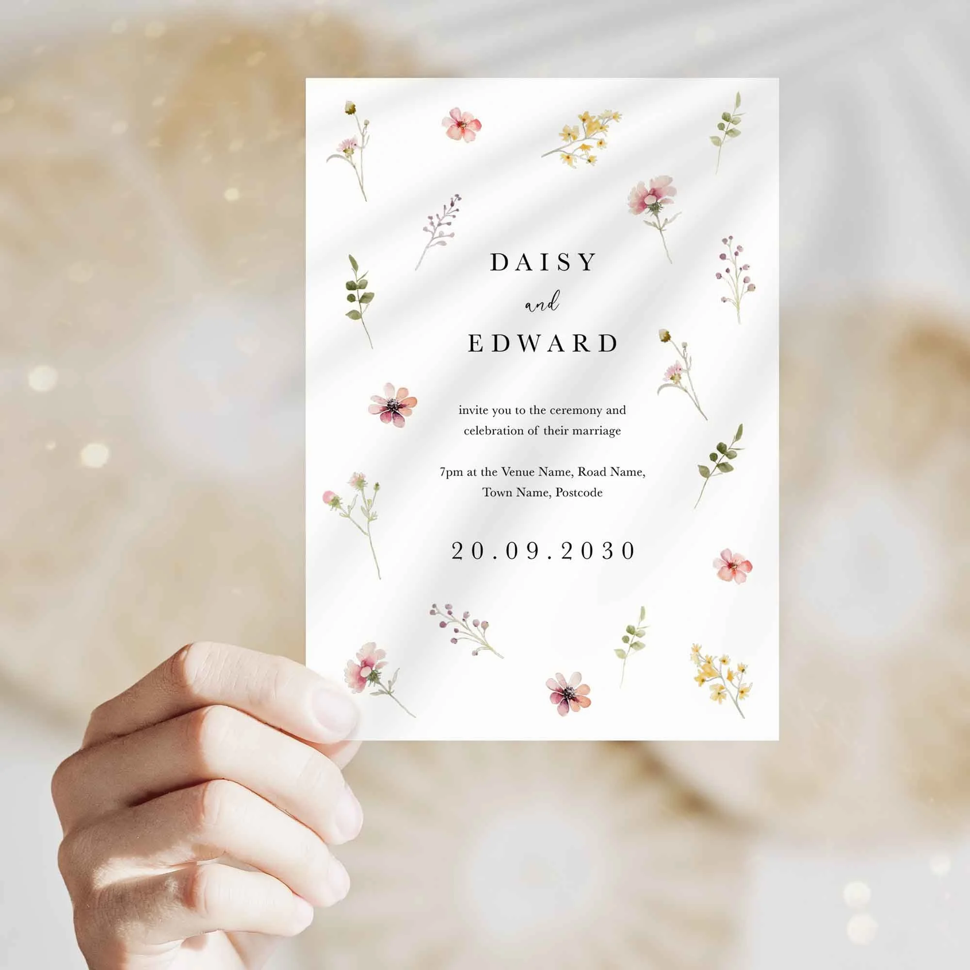 Hand holding Flora wedding invitation showing size and printed design details