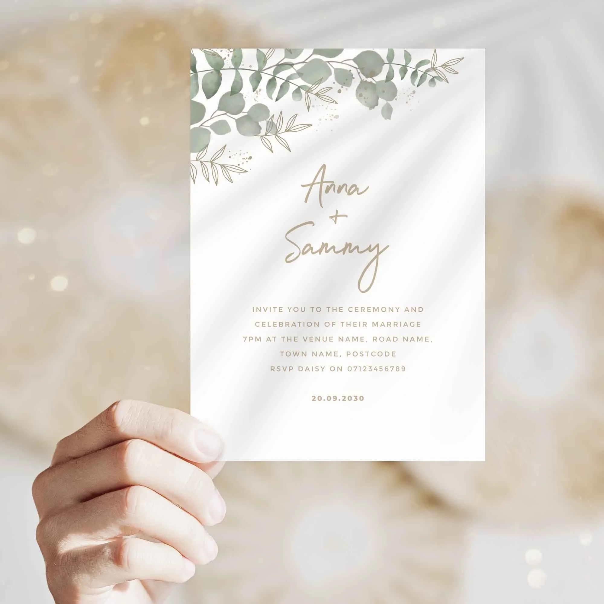 Hand holding Modern Eucalyptus wedding invitation showing size and printed design details