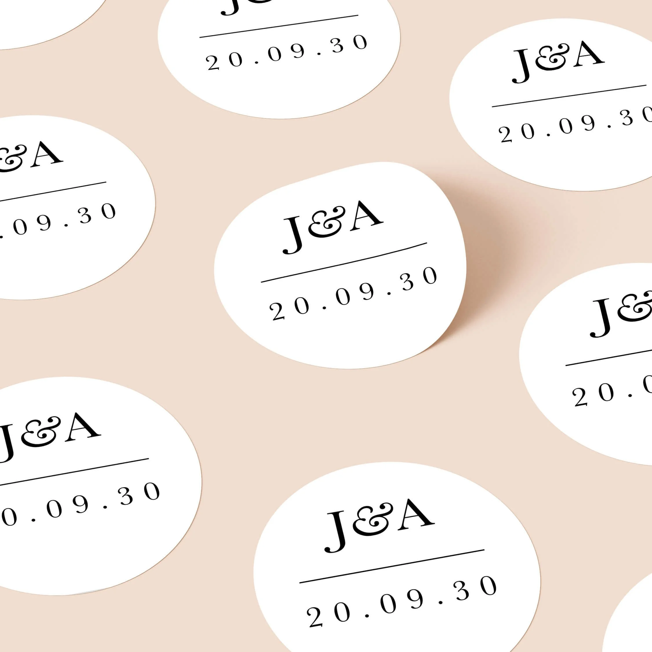Minimal personalised wedding stickers with elegant serif initials and wedding date design on round stickers