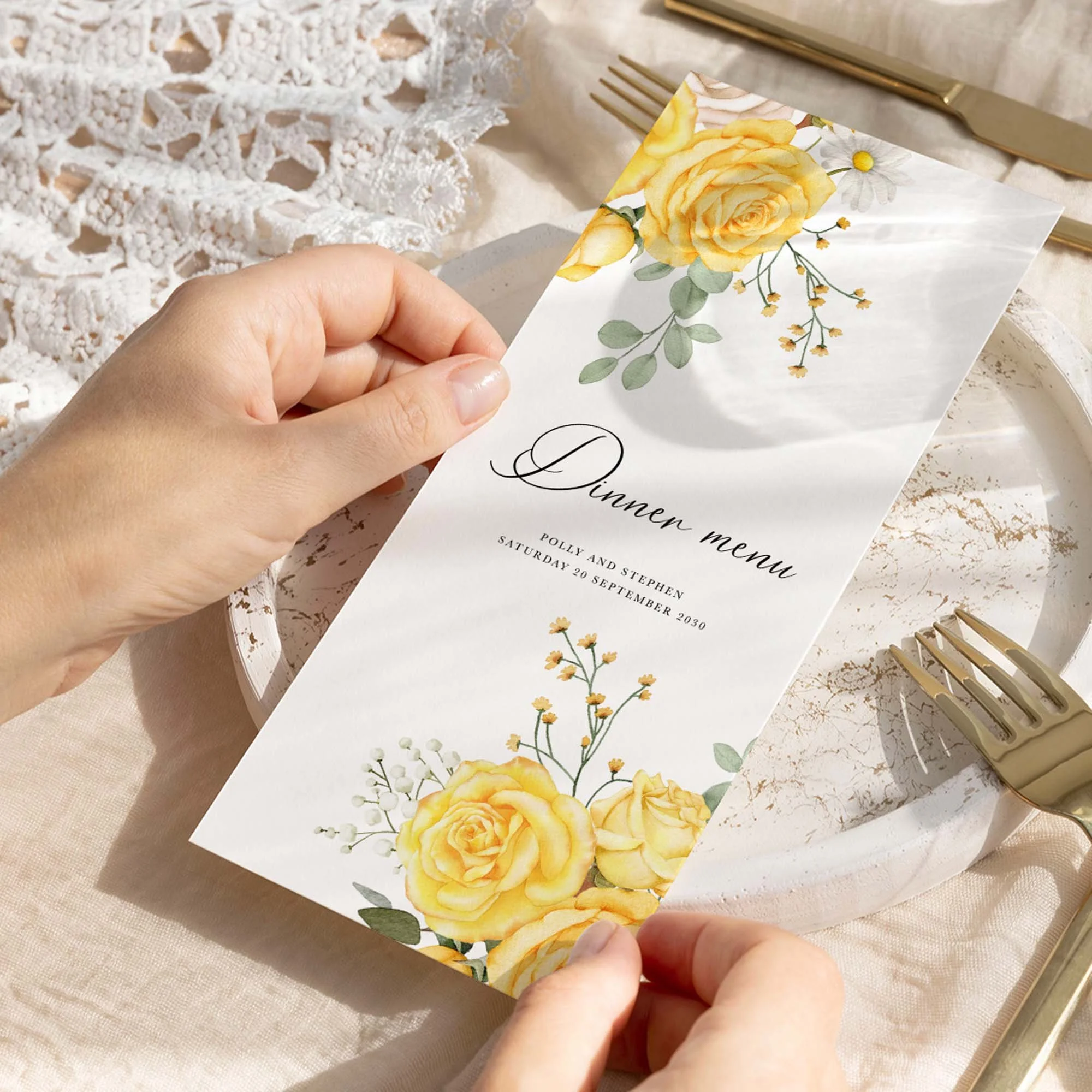 Hand holding Yellow Rose wedding menu card showing size and printed design details