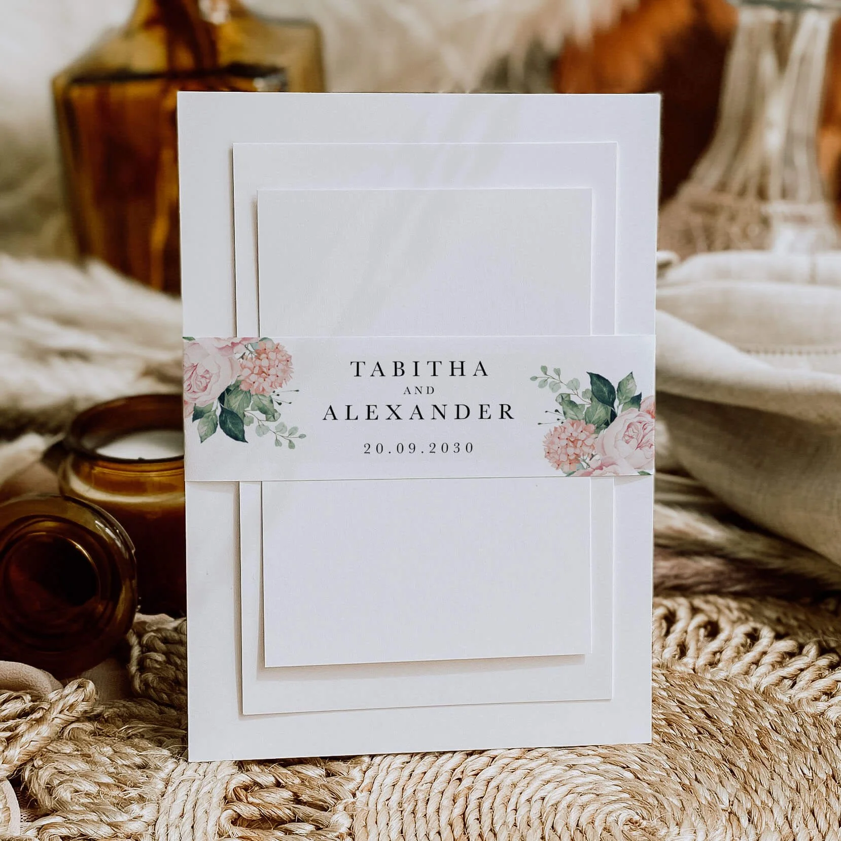 Blush Bouquet personalised wedding belly bands with blush pink rose and hydrangea watercolour illustration wrapped around wedding invitations