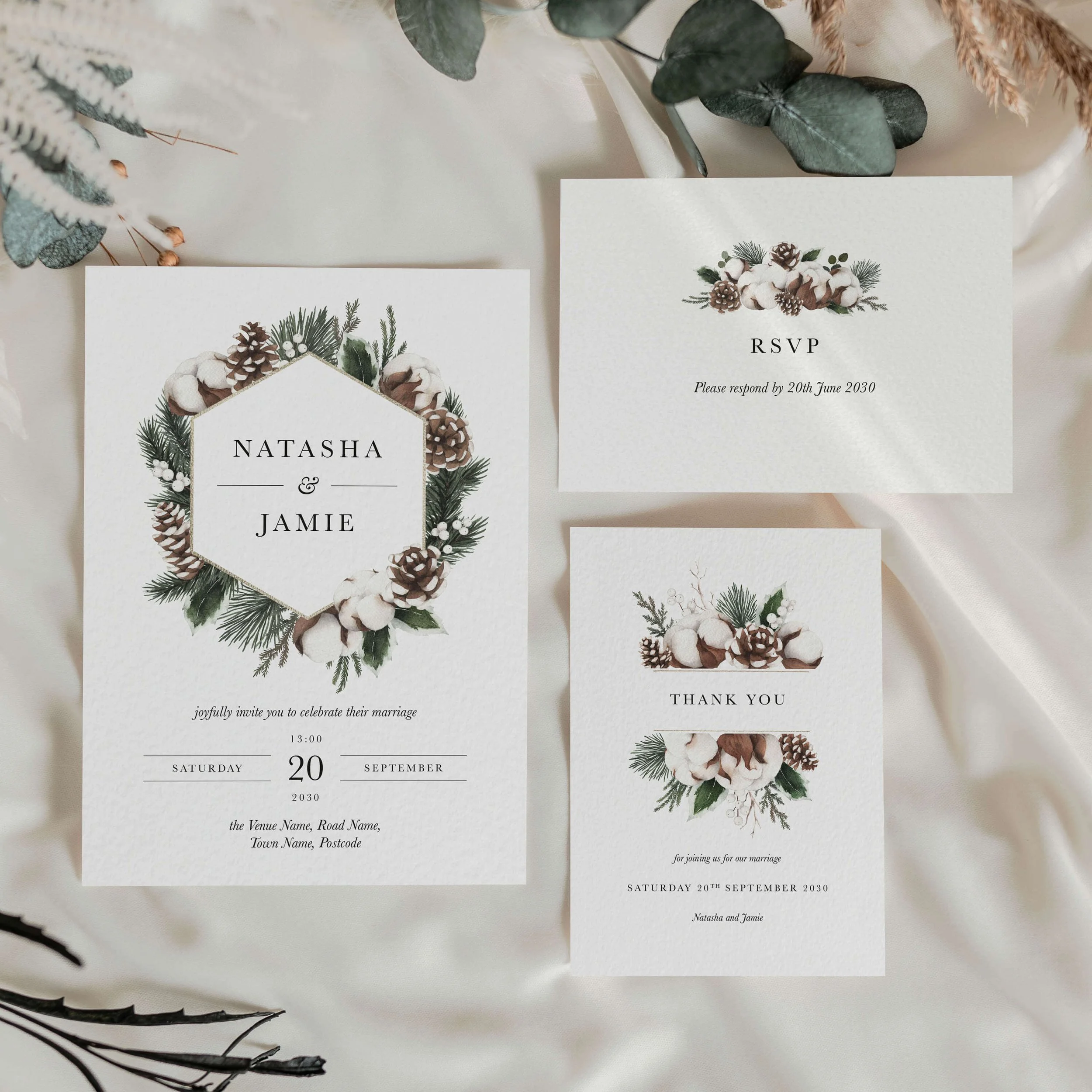 The Woodland wedding stationery collection showing invitation and thank you card with pine cone, cotton and evergreen botanical design in a geometric hexagonal frame