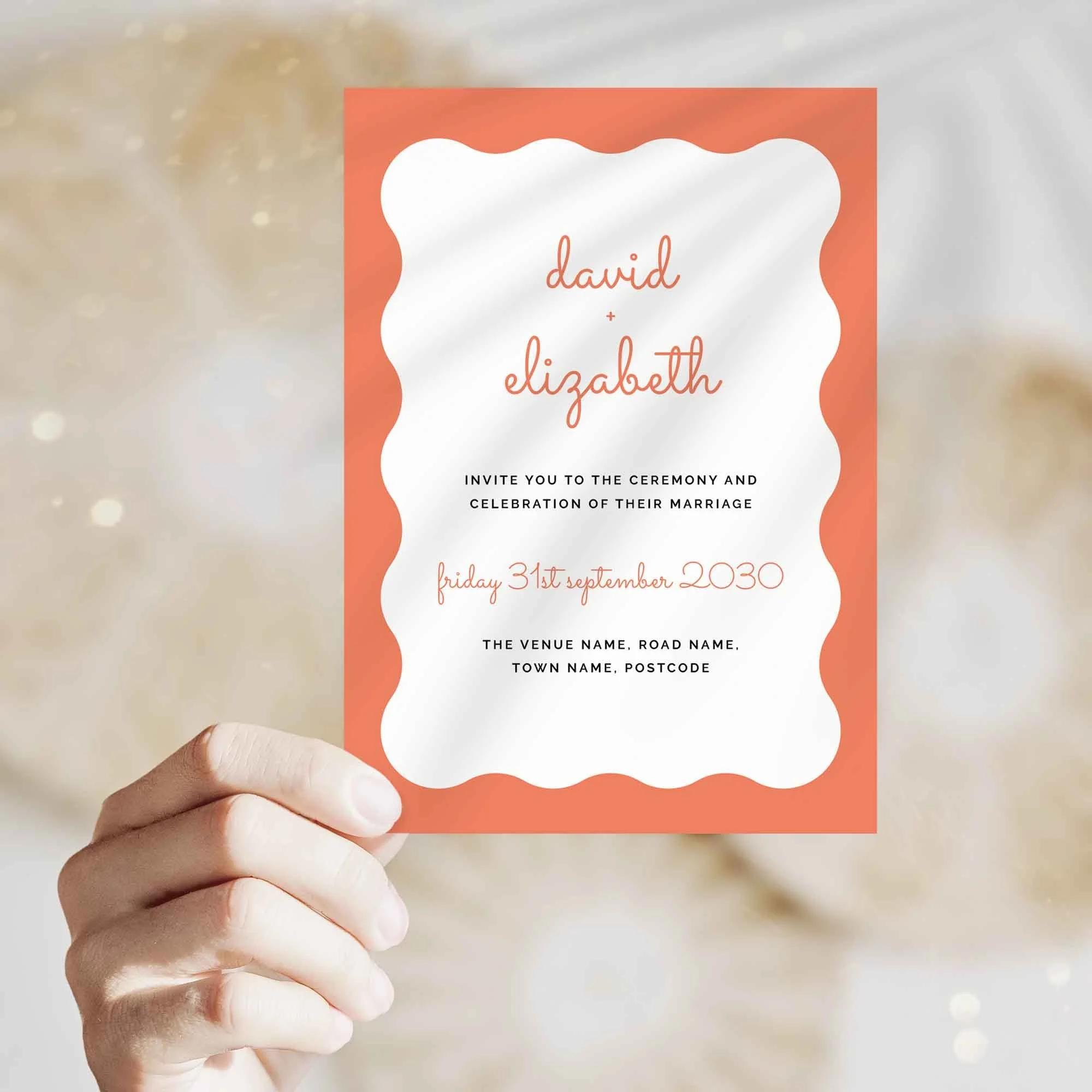 Hand holding Scallop wedding invitation showing size and printed design details