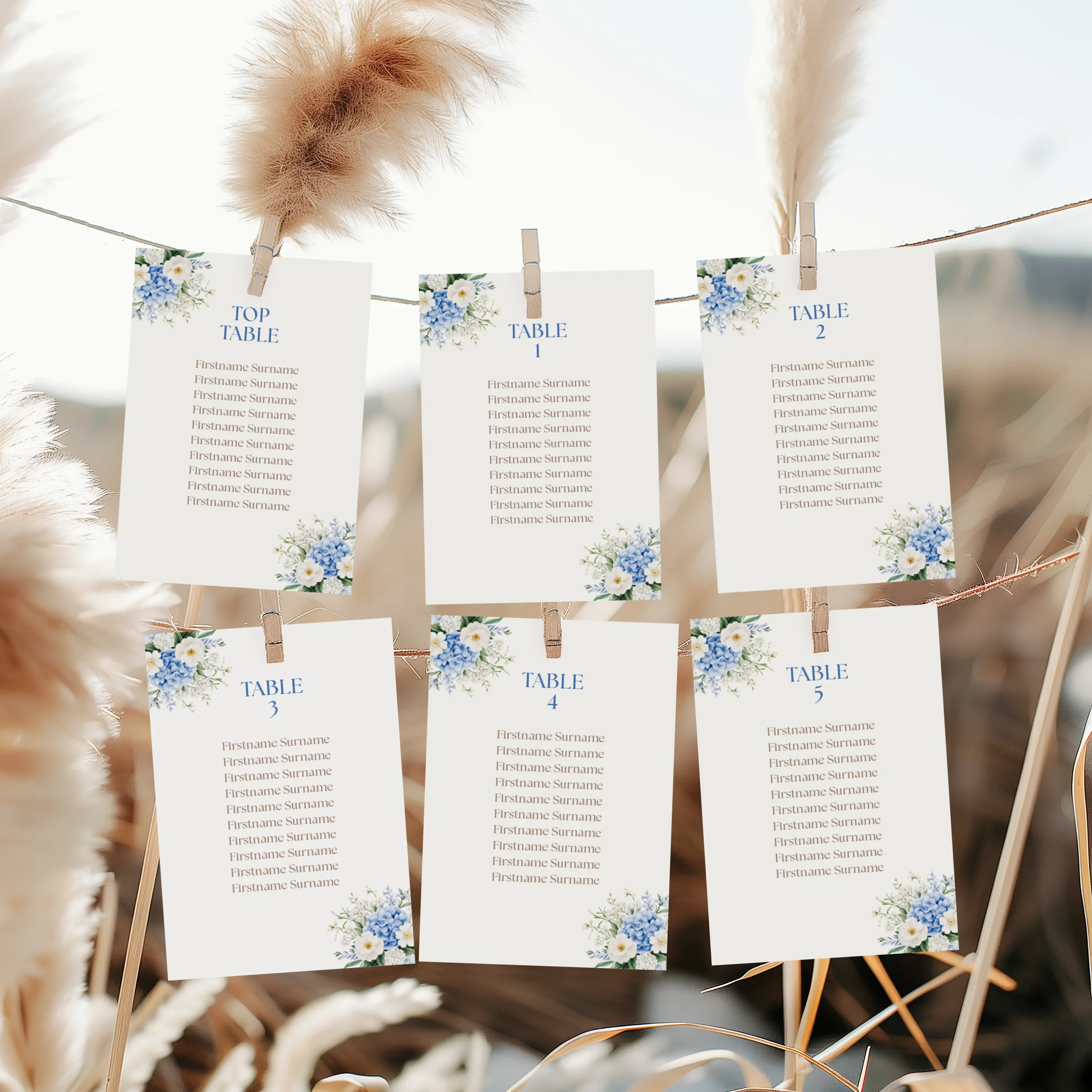 Serenity Wedding Seating Plan Cards with blue floral illustrations in the corners.