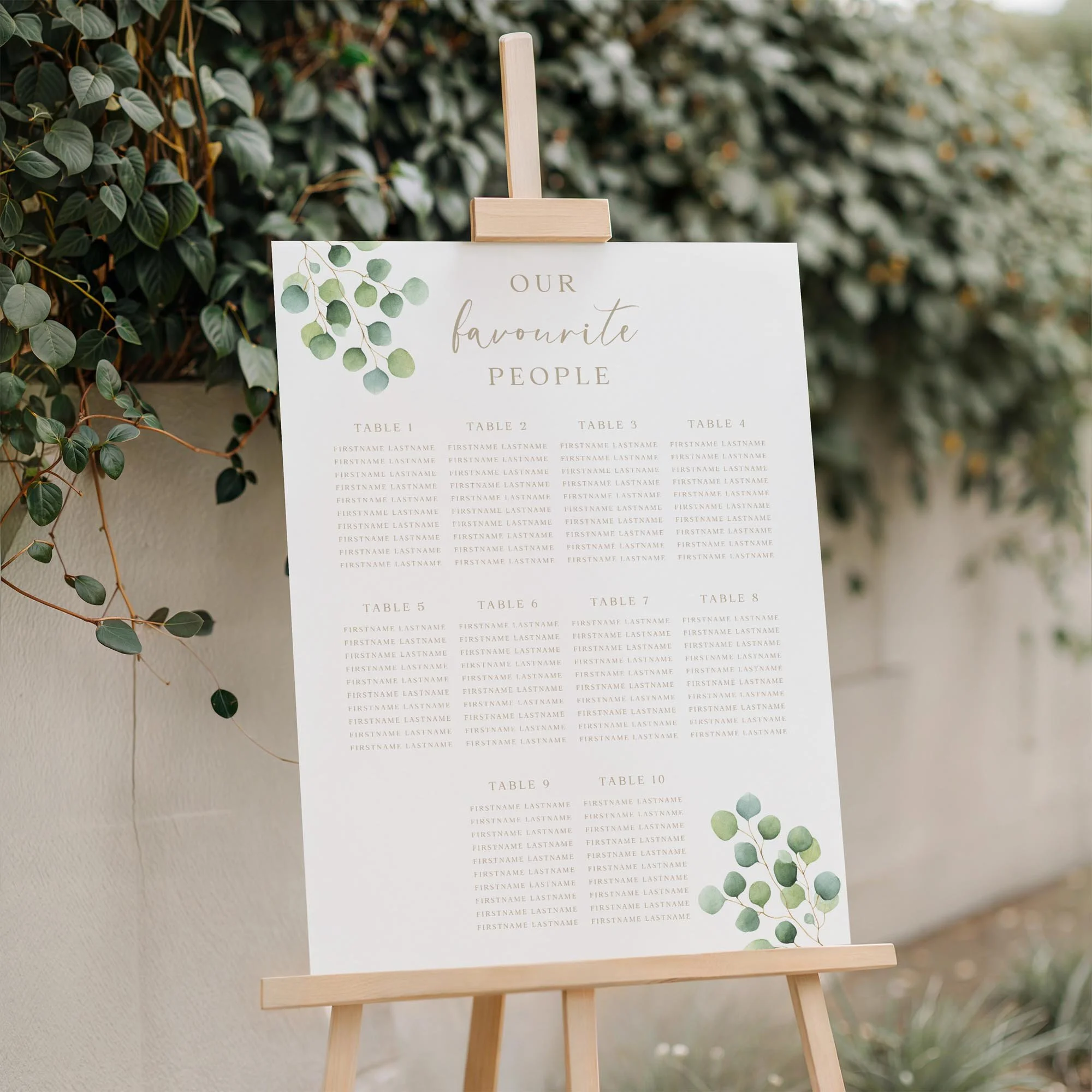 Close-up of the Eucalyptus Foliage wedding seating plan board displayed outdoors