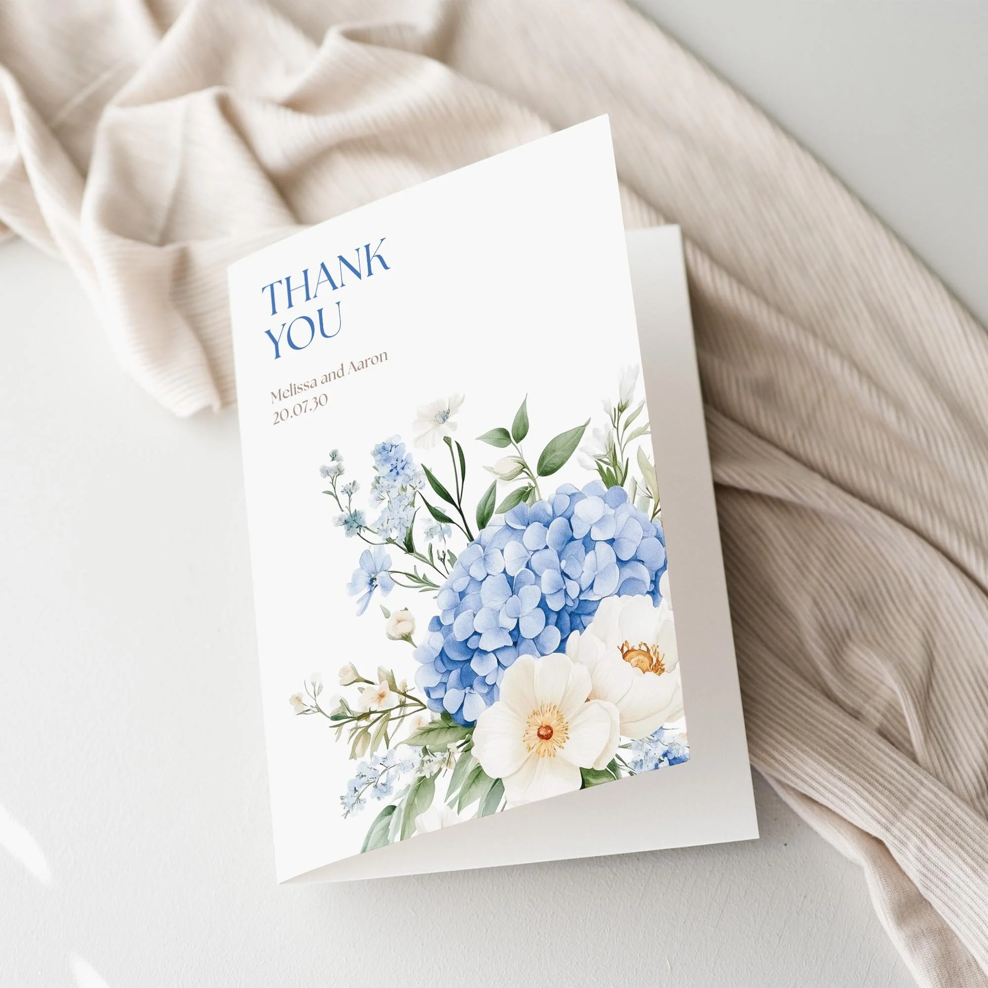 Serenity Wedding Thank You Card with blue floral illustrations in the corner.