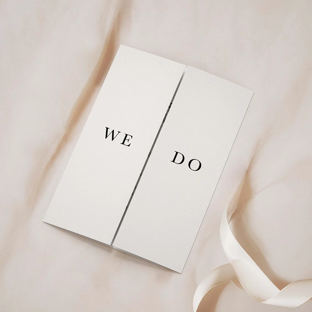 Monogram Collection gatefold wedding invitation closed, showcasing a bold black and white monogram design with sleek typography.