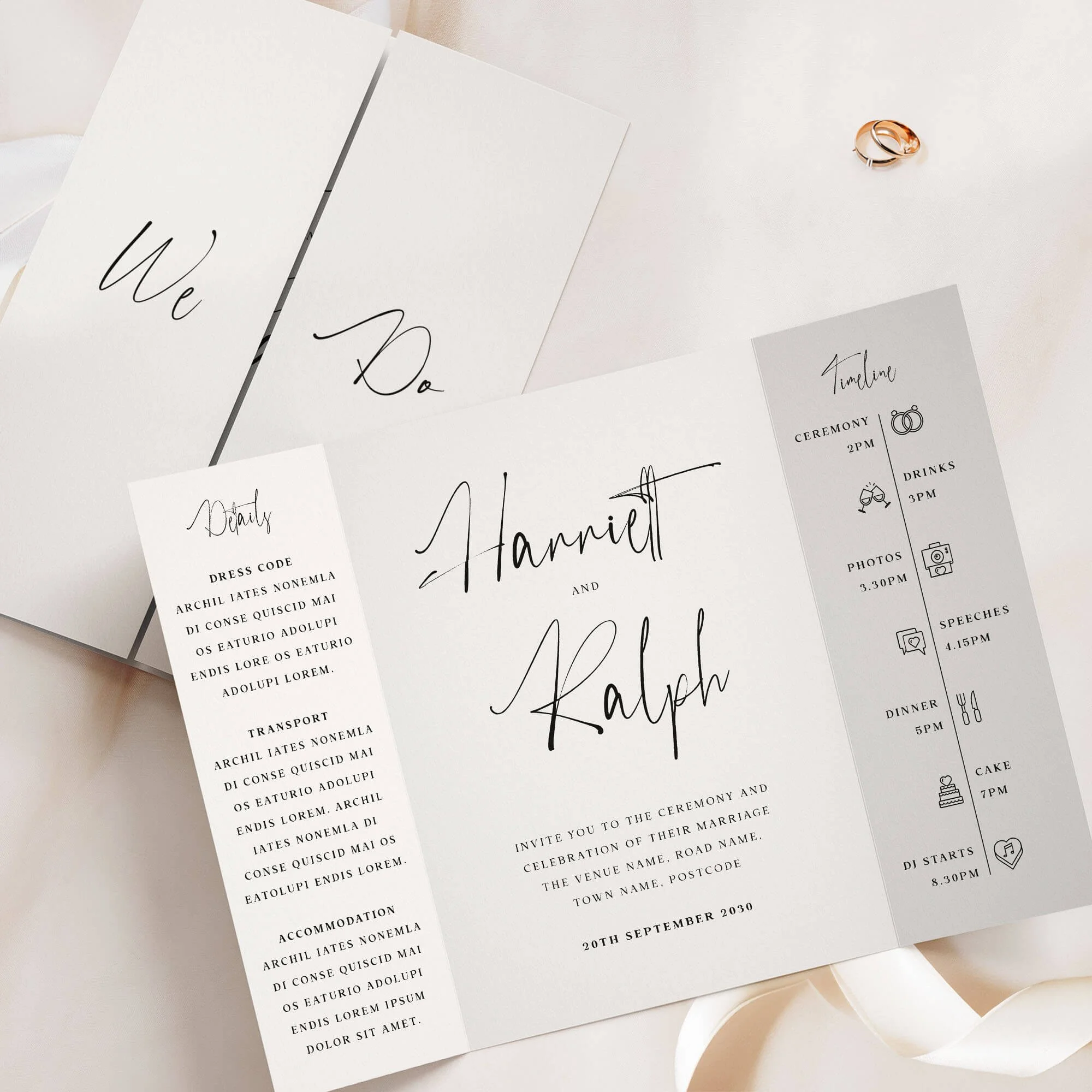Minimalist gatefold wedding invitation with elegant black calligraphy script names on cream