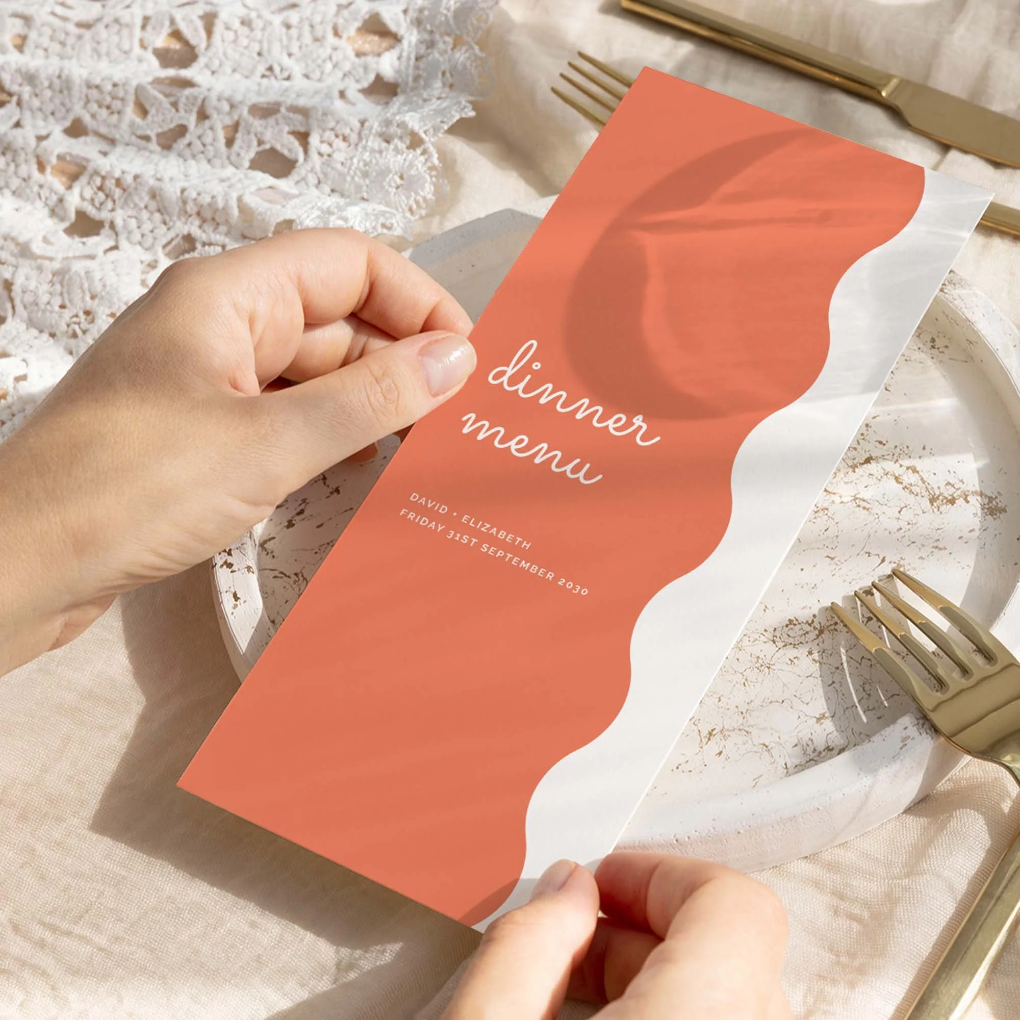 Hand holding Pastel Orange Scallop wedding menu card showing size and printed design details