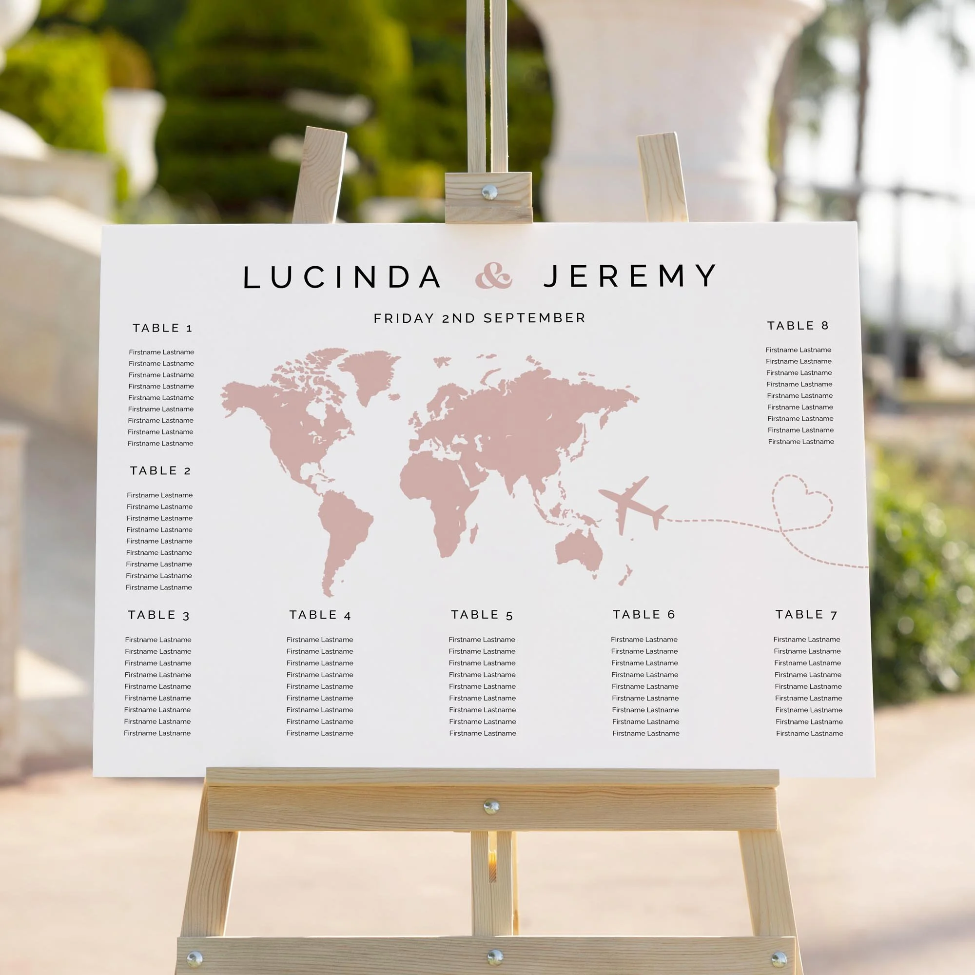 Close up of a Travel themed wedding seating chart board on easel