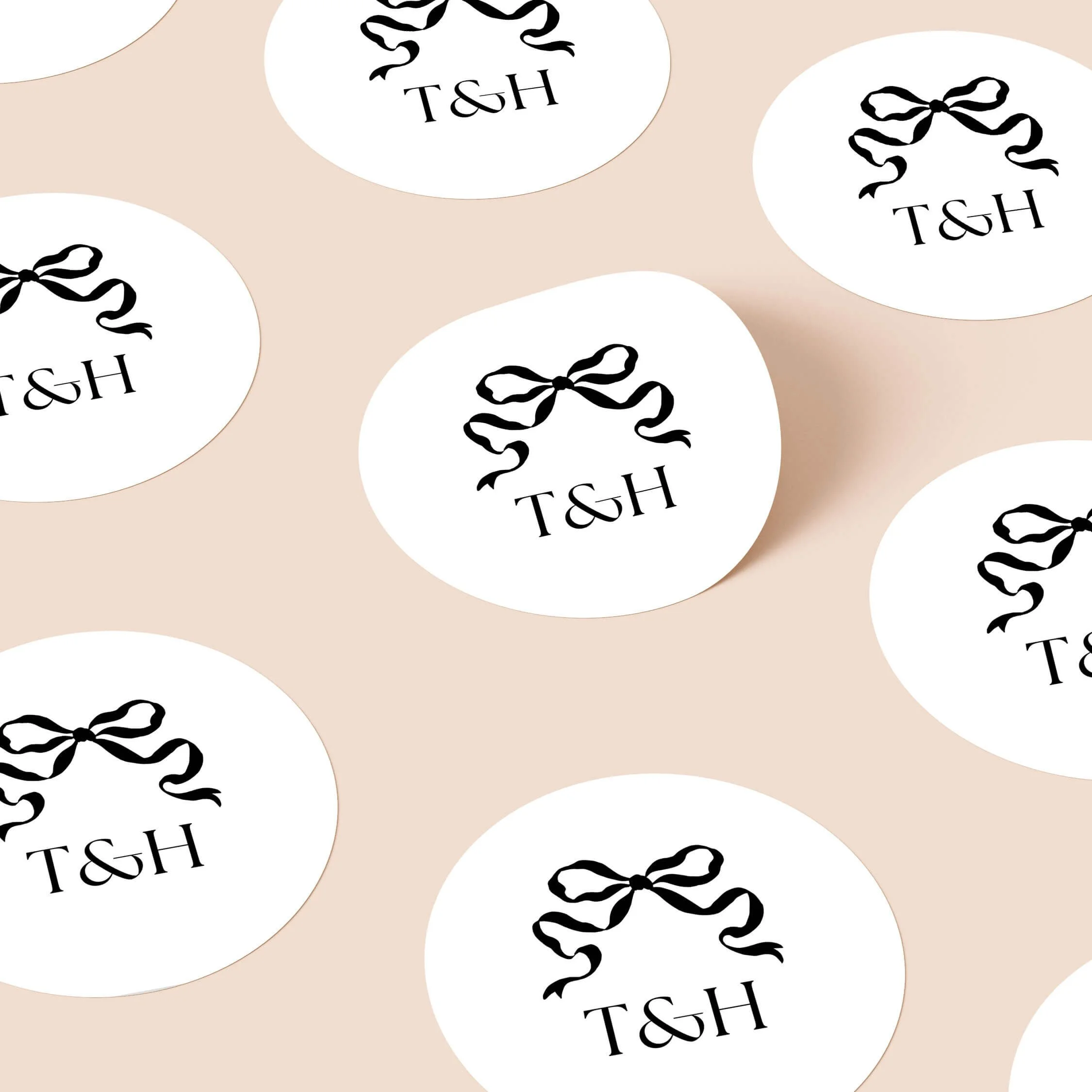 Black tie wedding stickers with bow illustration and serif initials