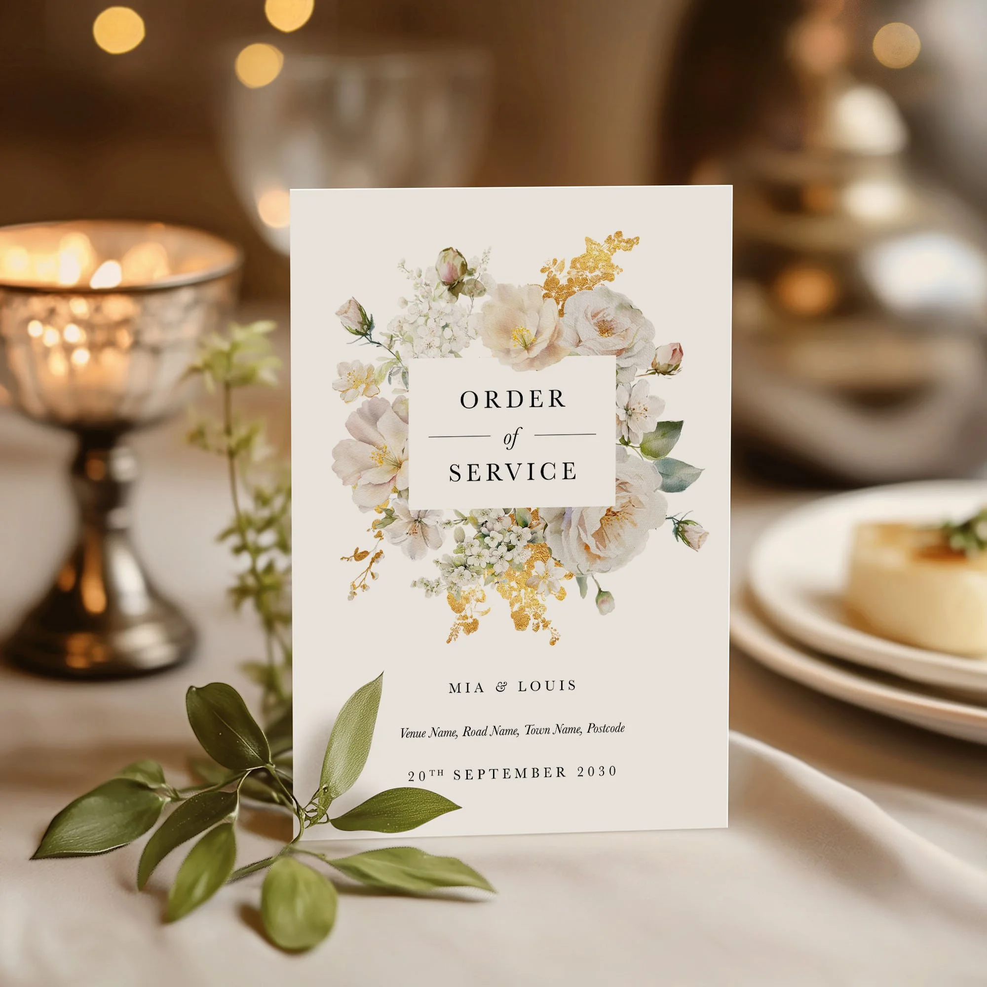 White and gold Floral wedding order of service on a wedding day displayed