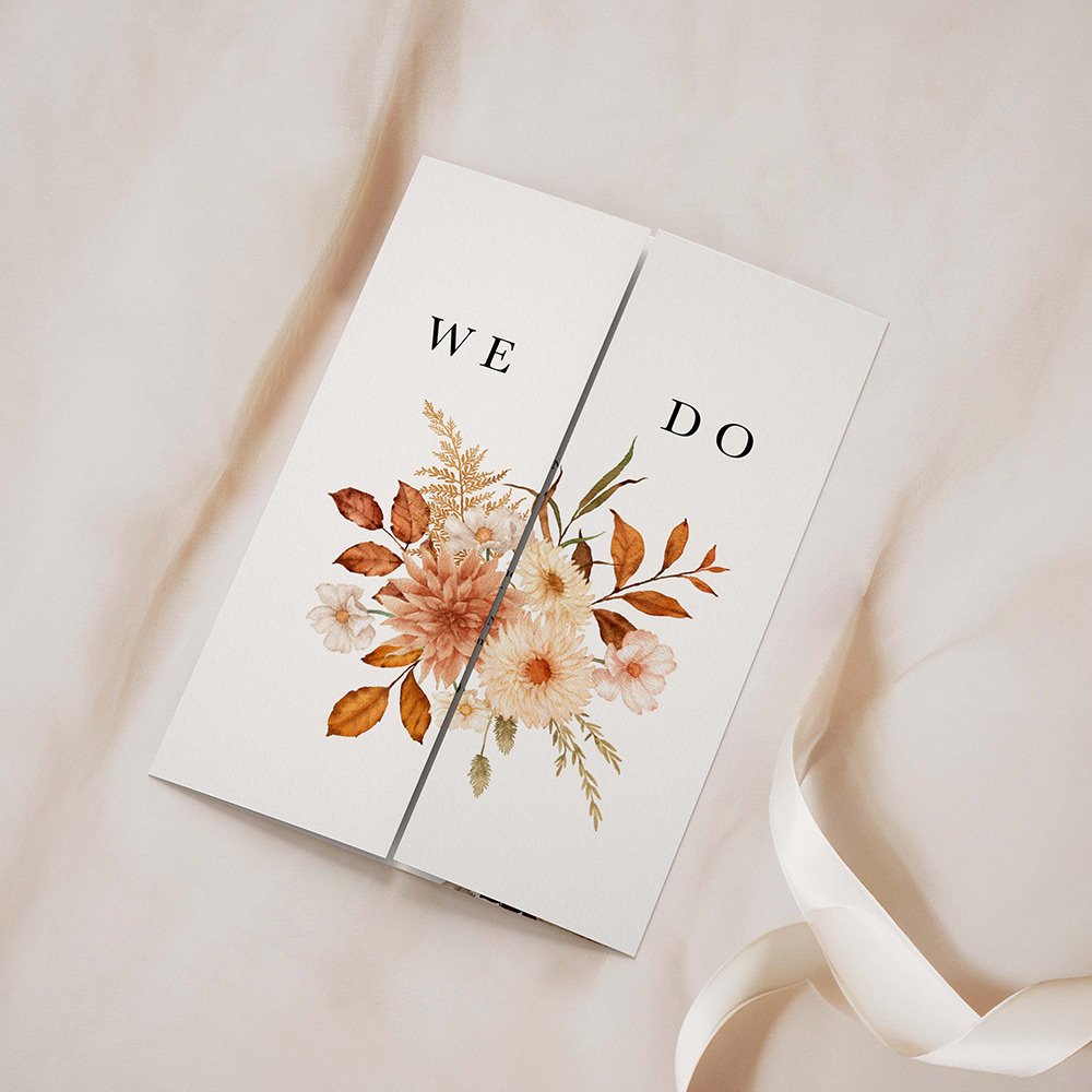 Rustic Collection gatefold wedding invitation closed, featuring rust orange florals and greenery on a white background.