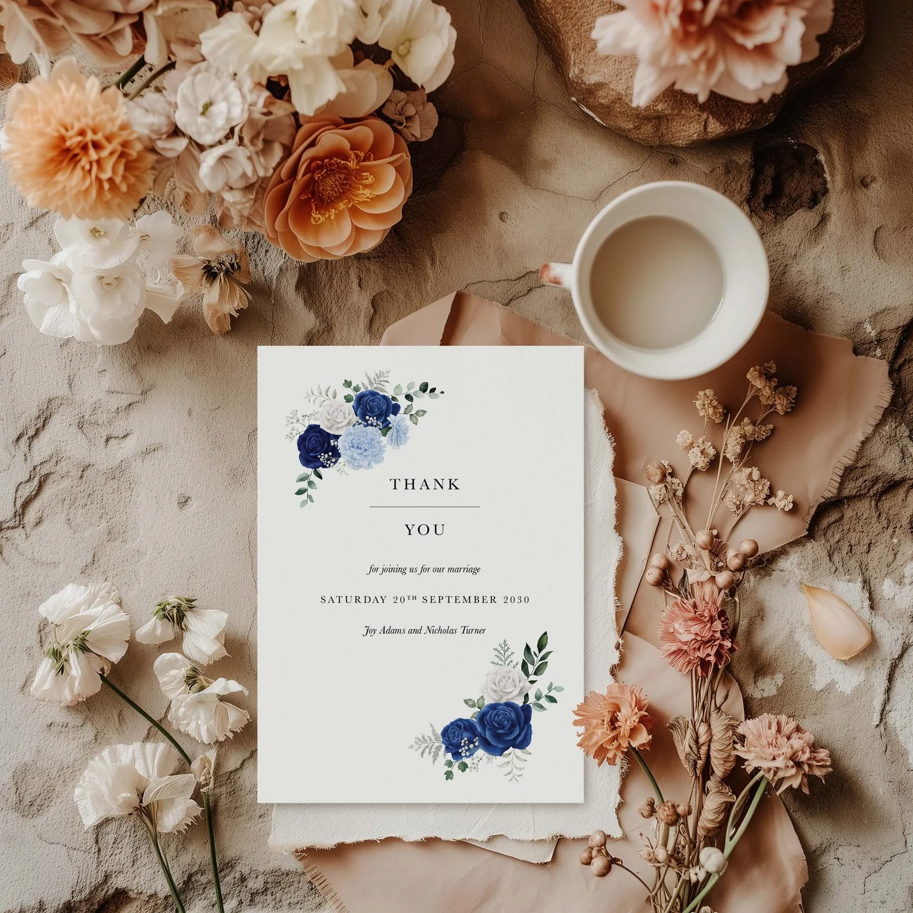Royal Blue and White Rose wedding thank you card styled with flowers and stationery details