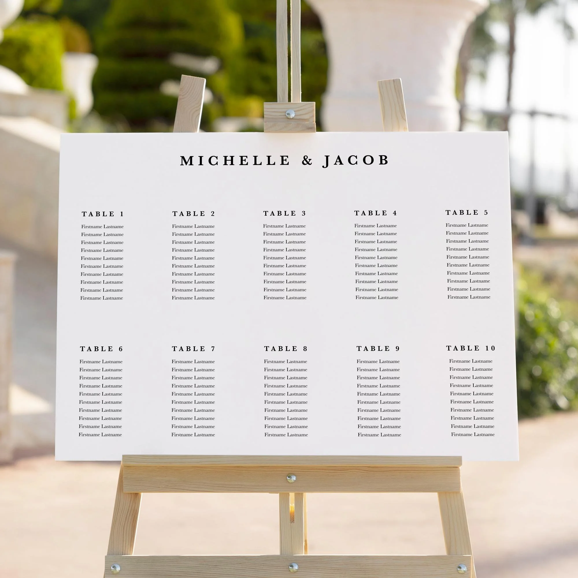 Black and White Serif wedding seating chart sign in a minimal modern landscape design styled at a reception