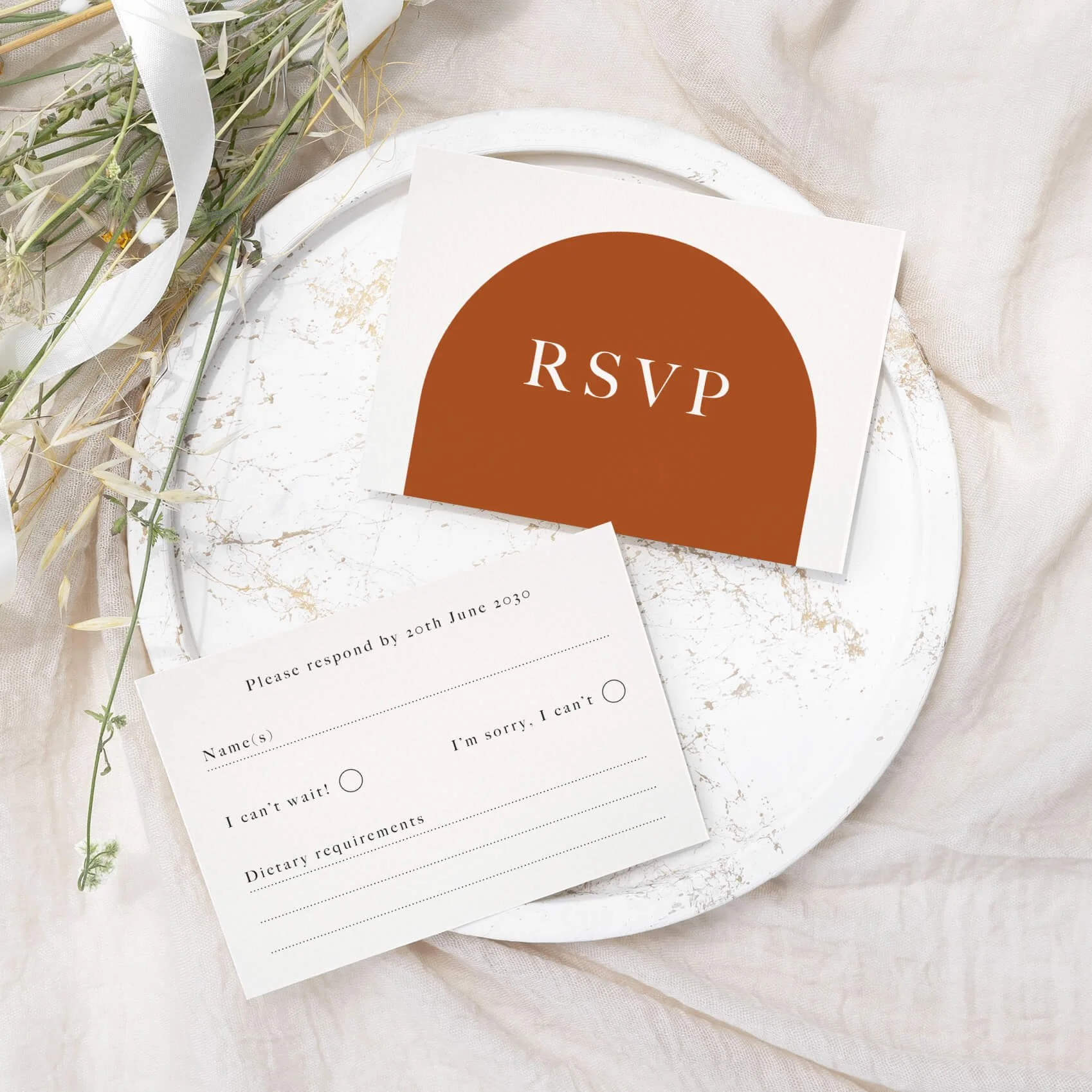 Arch wedding RSVP card with modern burnt orange arch design and minimalist typography on luxury off-white card