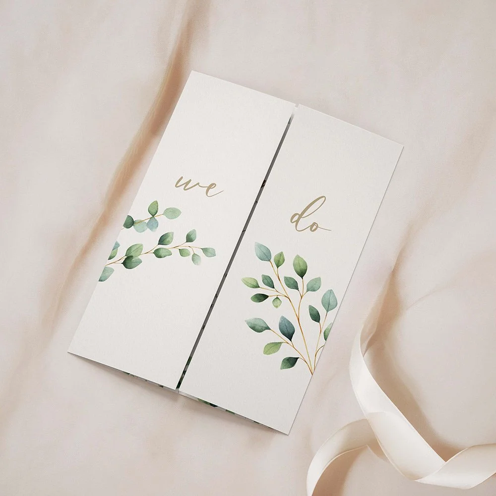 Eucalyptus Foliage Collection gatefold invitation closed, featuring green eucalyptus leaves and gold calligraphy font with delicate branch accents.