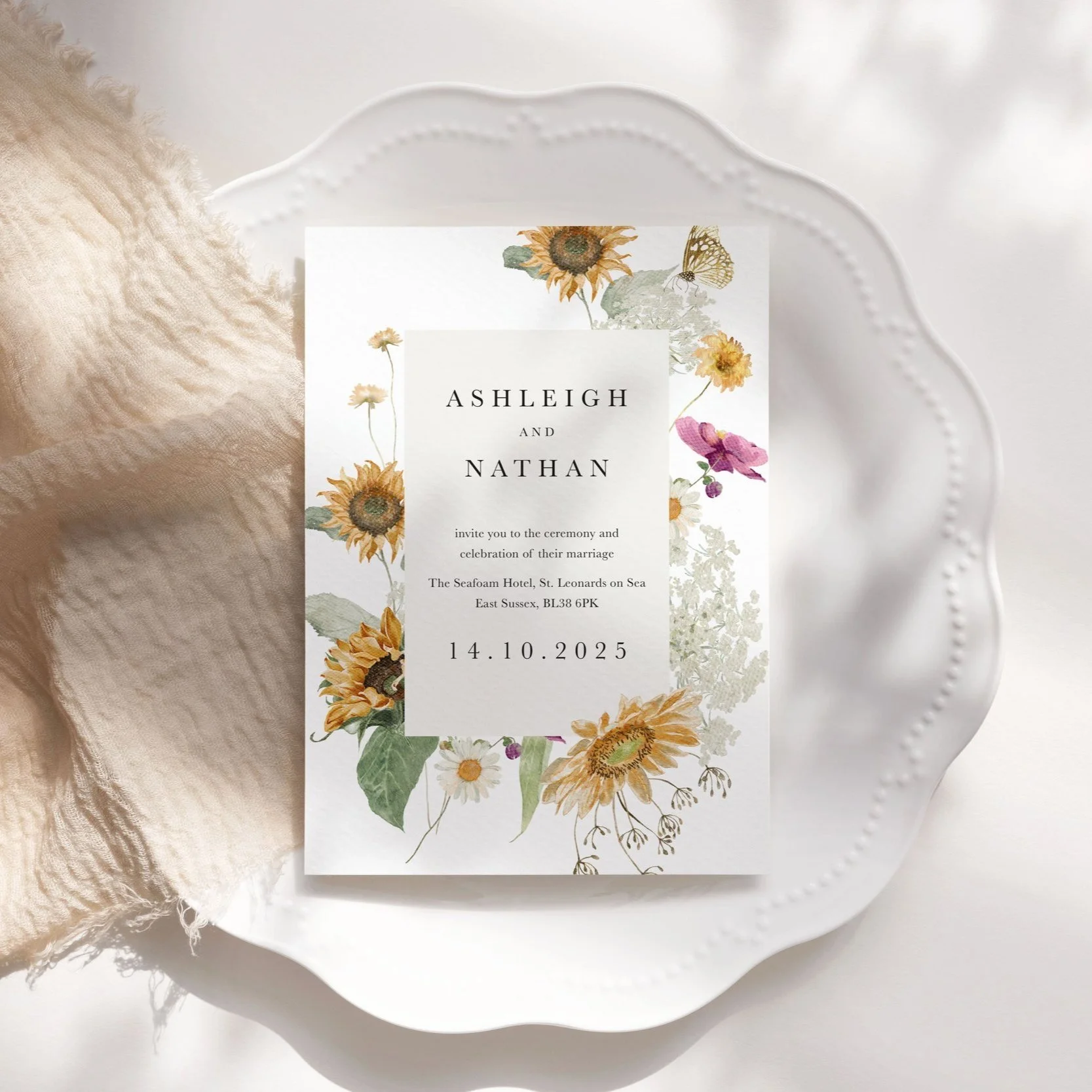 Autumn wedding invitation with sunflowers, butterflies, and pink floral accents