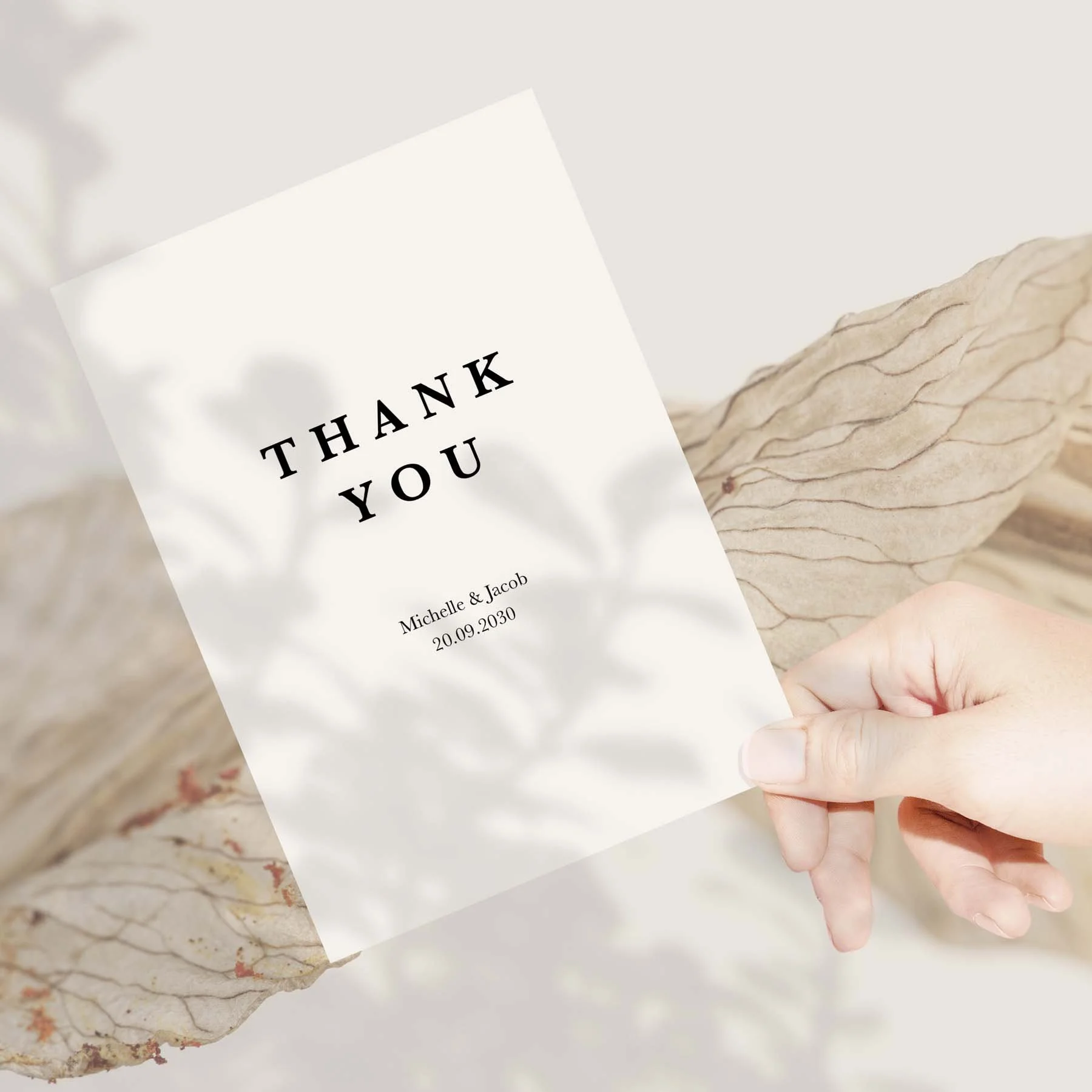 Hand holding a Minimal wedding thank you card