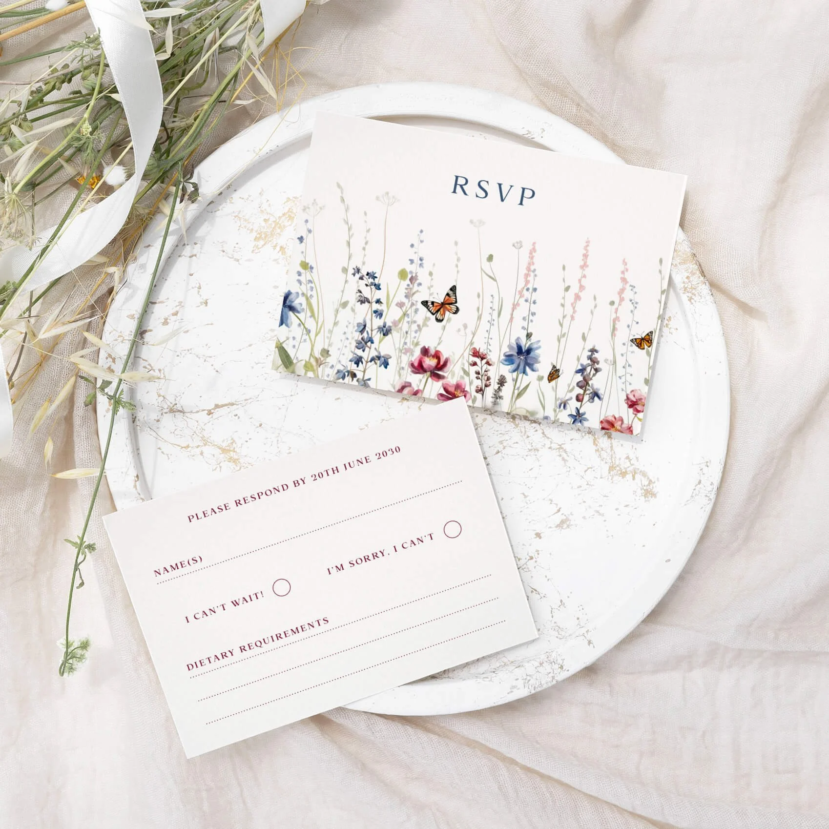 Navy wildflower wedding RSVP card with floral border and response fields