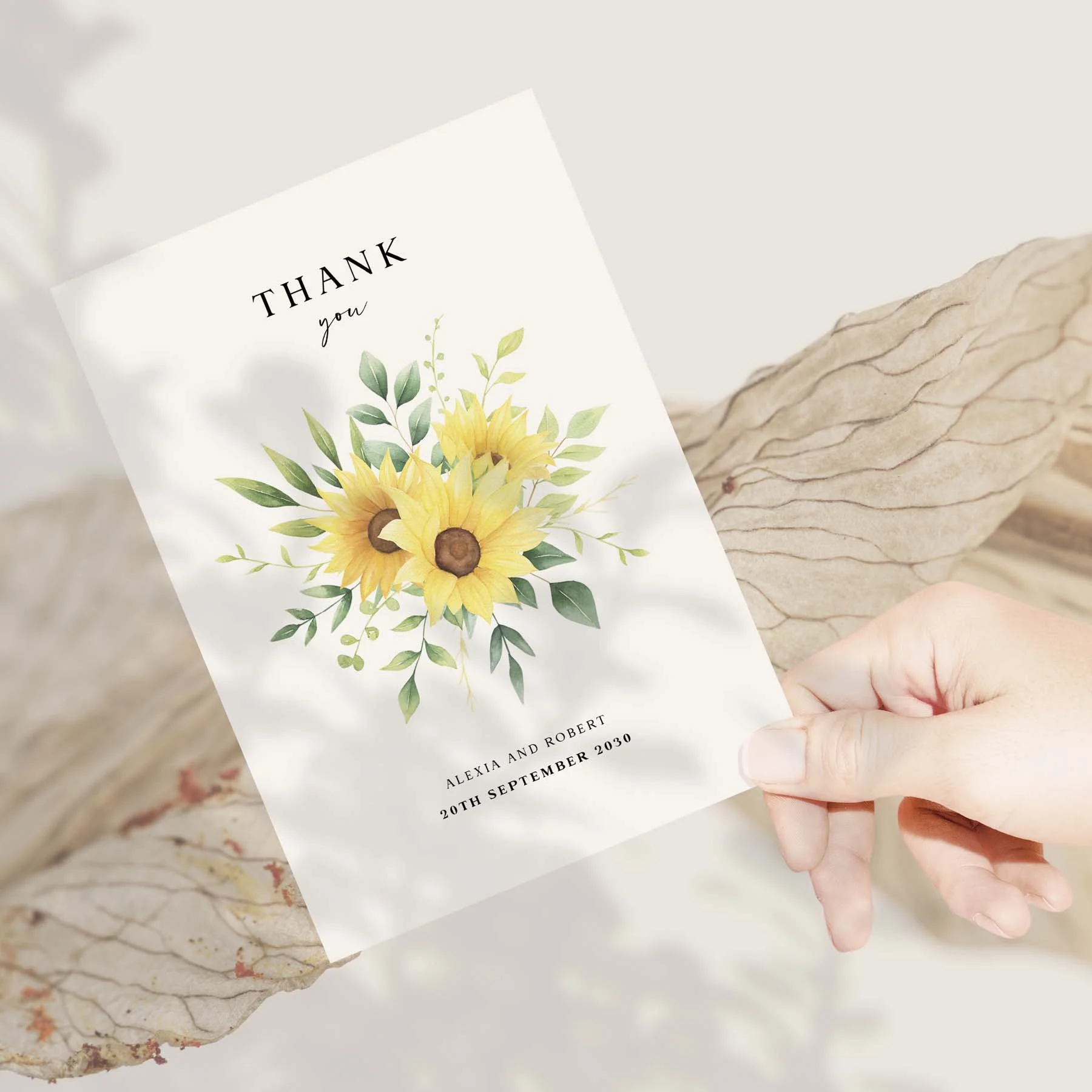 Hand holding a sunflower design wedding thank you card