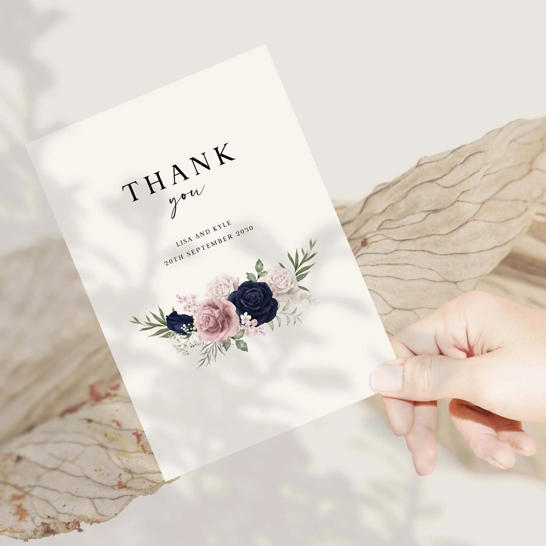 Hand holding a Blue and Pink Floral wedding thank you card