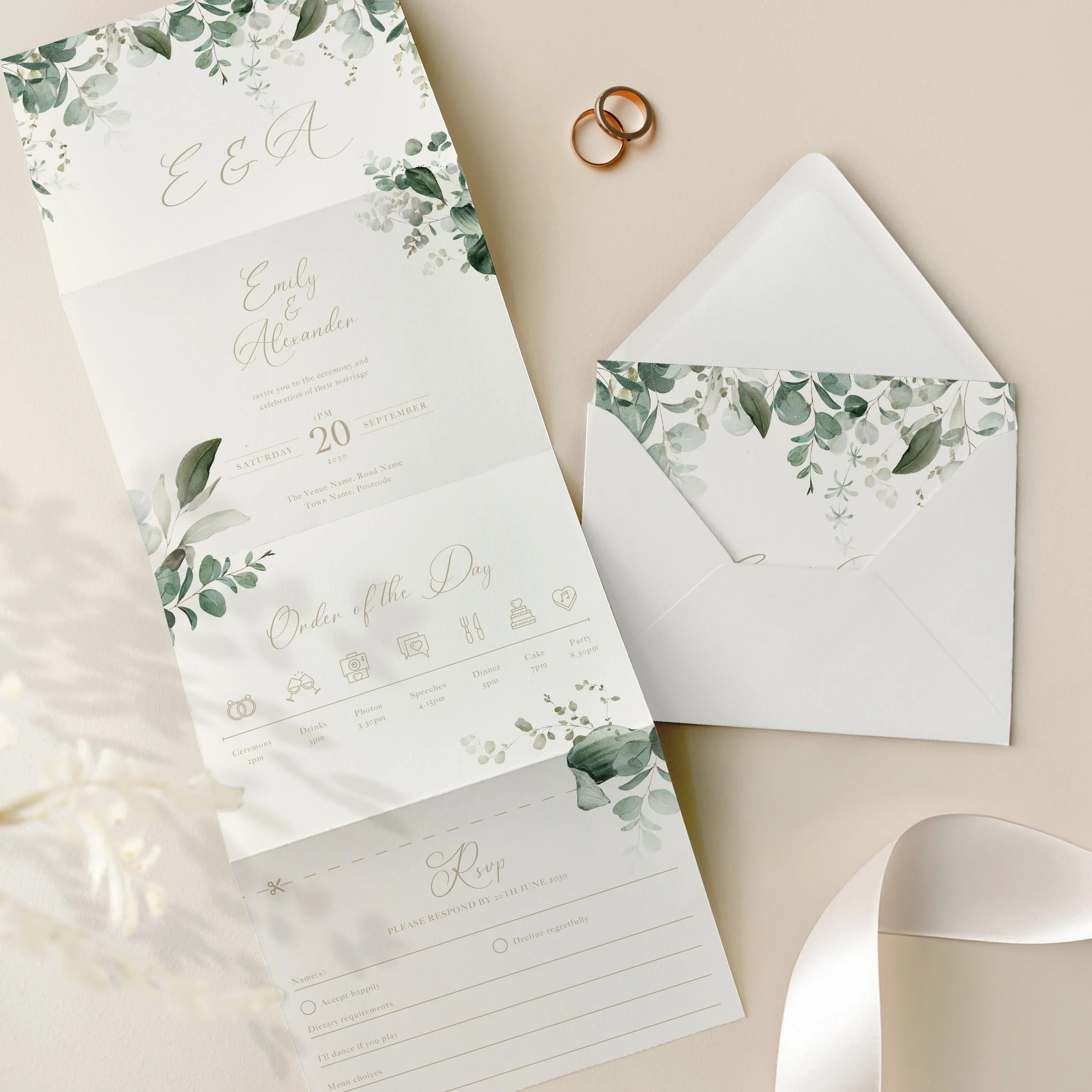 Concertina wedding invitation featuring emerald green foliage, an order of the day with icons and a perforated tear off RSVP card.