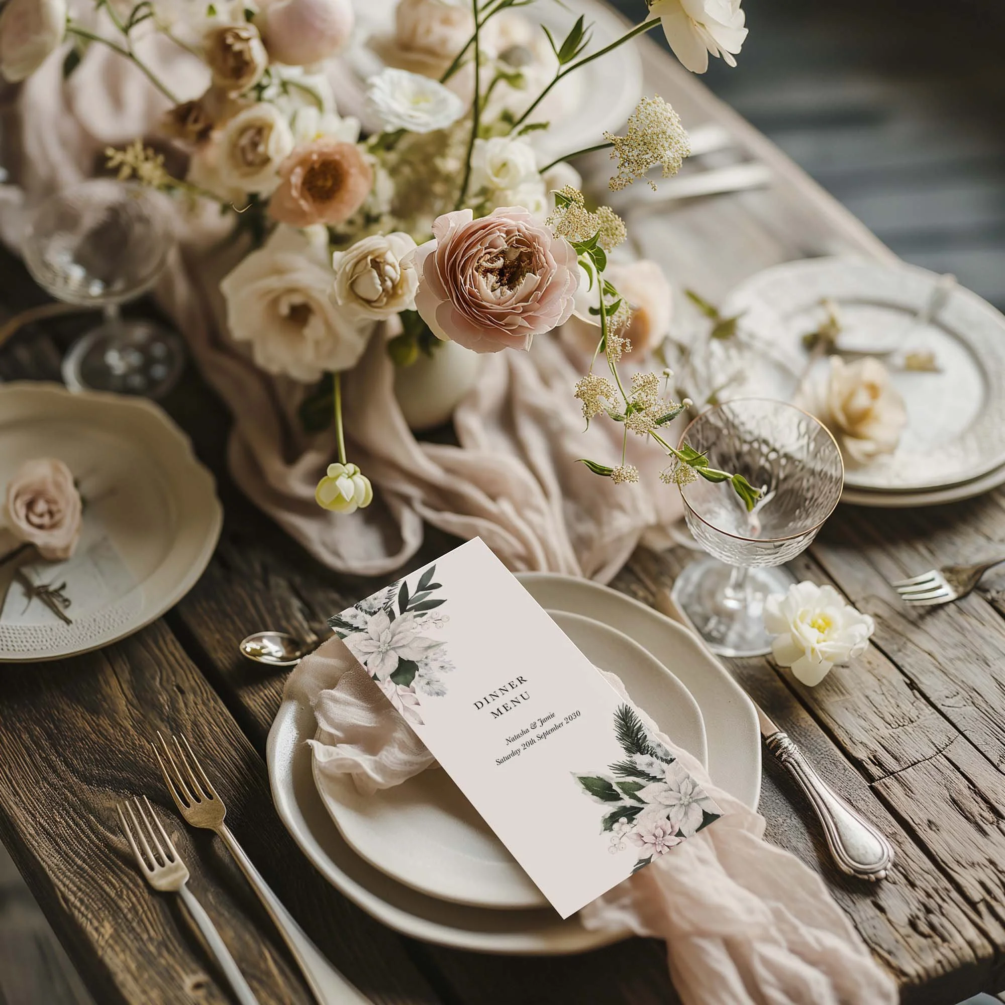 Winter Poinsettia wedding menu card styled on a wedding table setting with tableware and décor